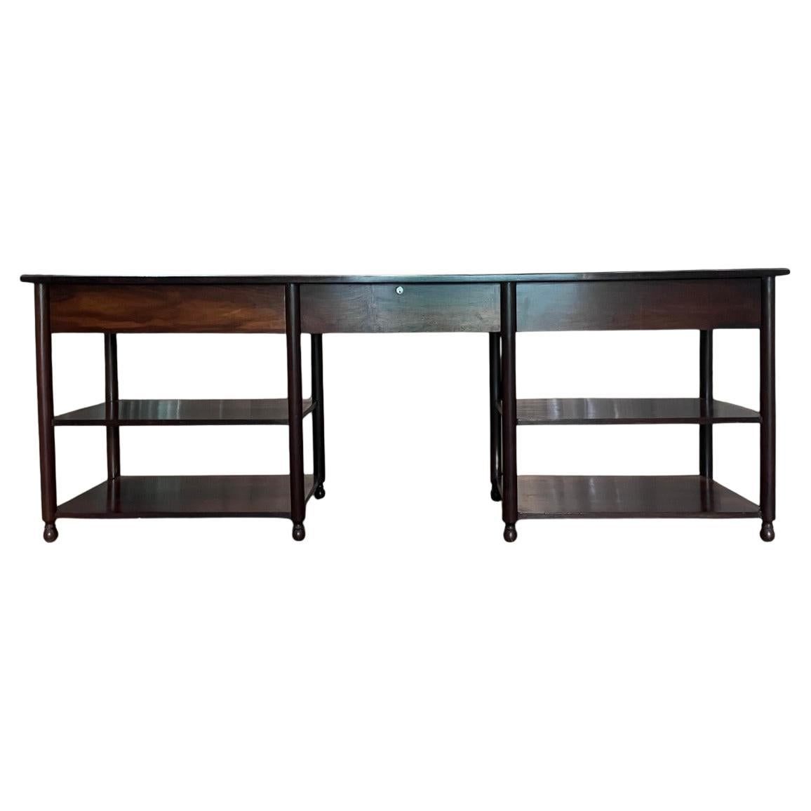 Available today, this elegant sideboard or dresser was designed in the 1960s. It is crafted from Brazilian Rosewood, meticulously refinished by our skilled artisans in Brazil, highlighting its vibrant veins. The sideboard features three pullout