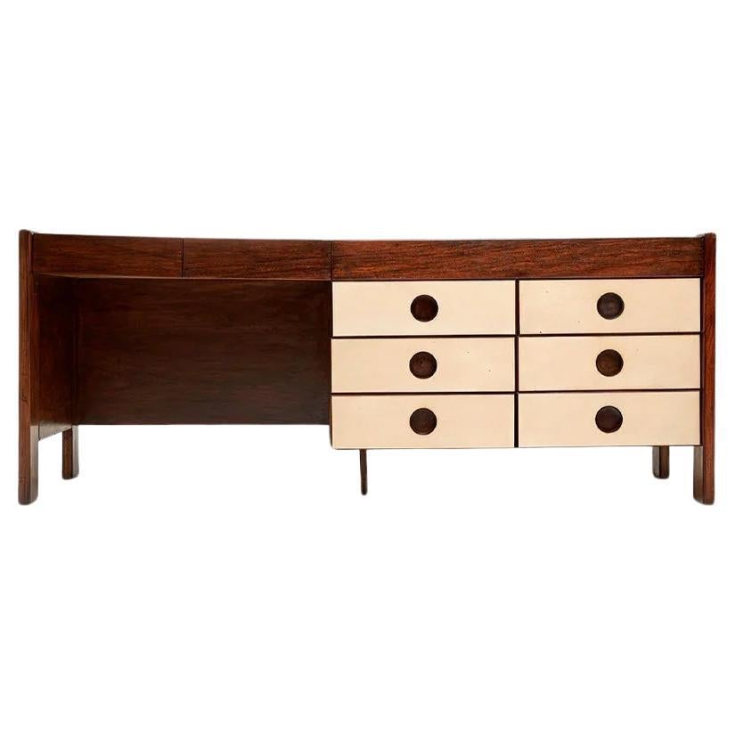 Available today, with domestic shipping in NYC metro area included, this Brazilian Modern Dresser with Six drawers in Hardwood, Jorge Zalszupin, c. 1970s is nothing less than gorgeous!  

This desk has a storied history, originating from the Hotel
