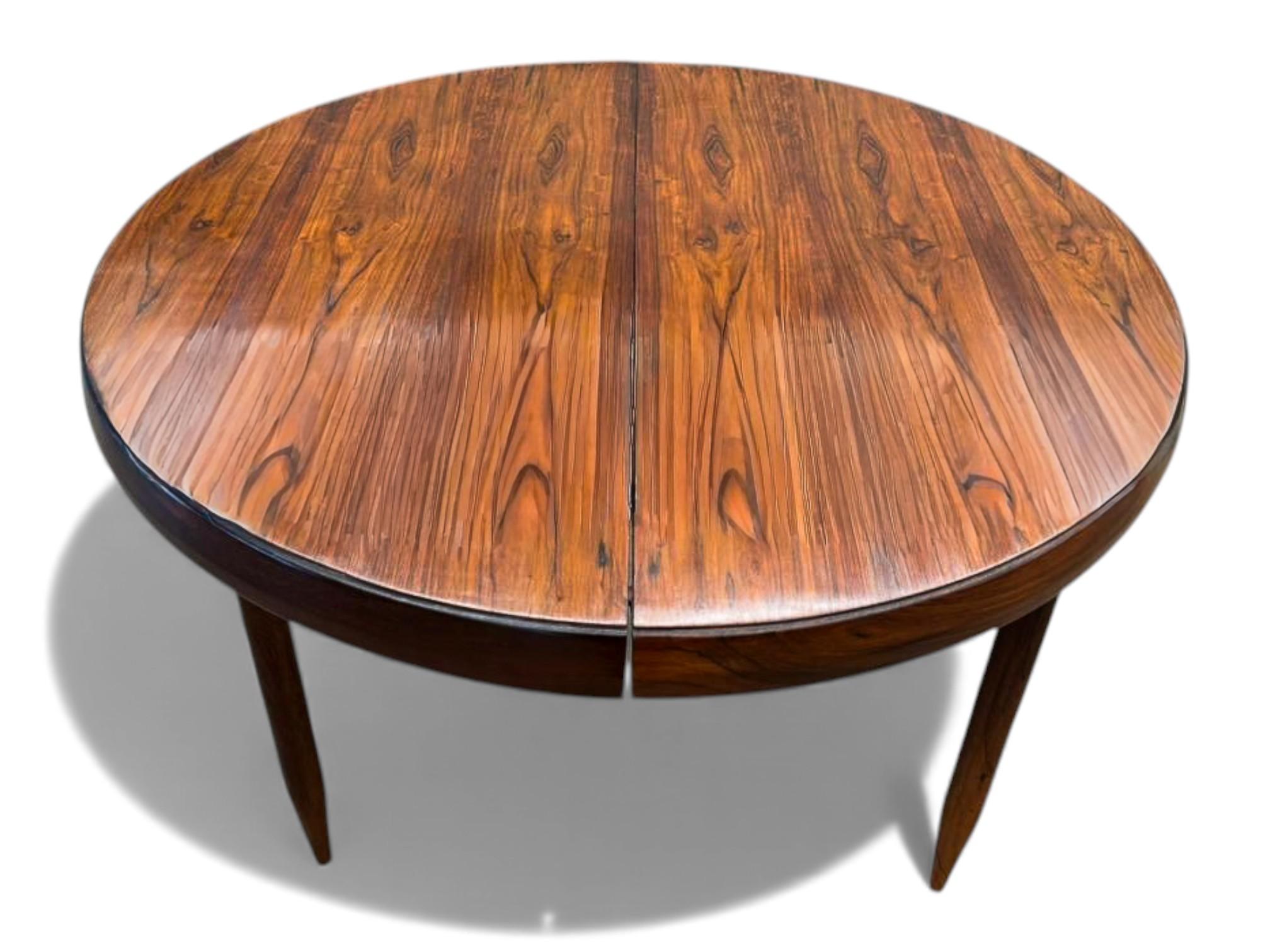 This elegant expandable dining table, designed by Jorge Jabour, showcases the timeless beauty and craftsmanship of mid-century Brazilian furniture. Built in richly grained rosewood, the table features a warm, expressive surface with natural