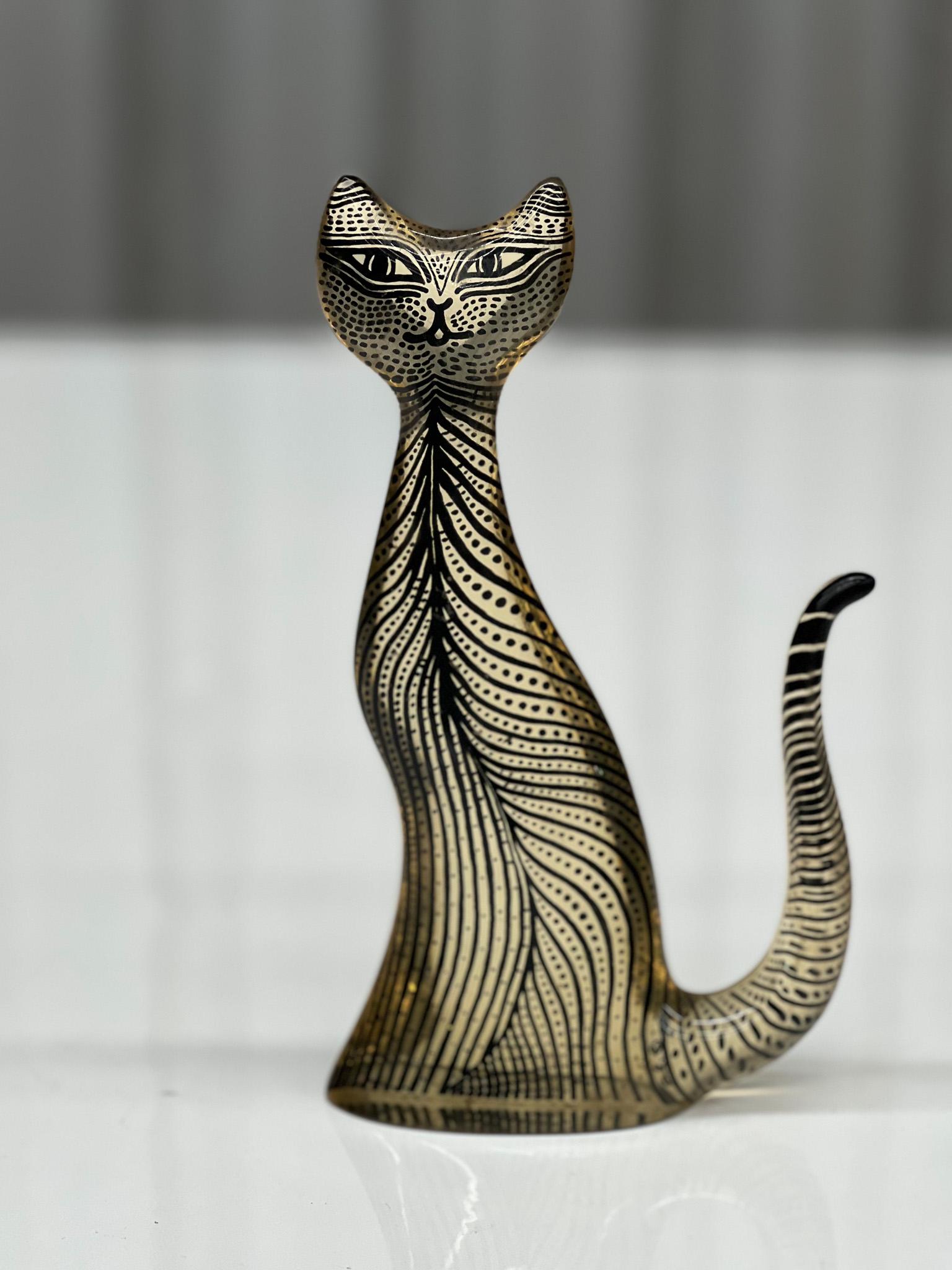 This Brazilian modern kinetic sculpture of a cat in resin was designed by Abraham Palatinik in the 1960s. This is part of the Artemis collection that features hundreds of different animals, each with sleek, flat silhouettes. This fun and playful