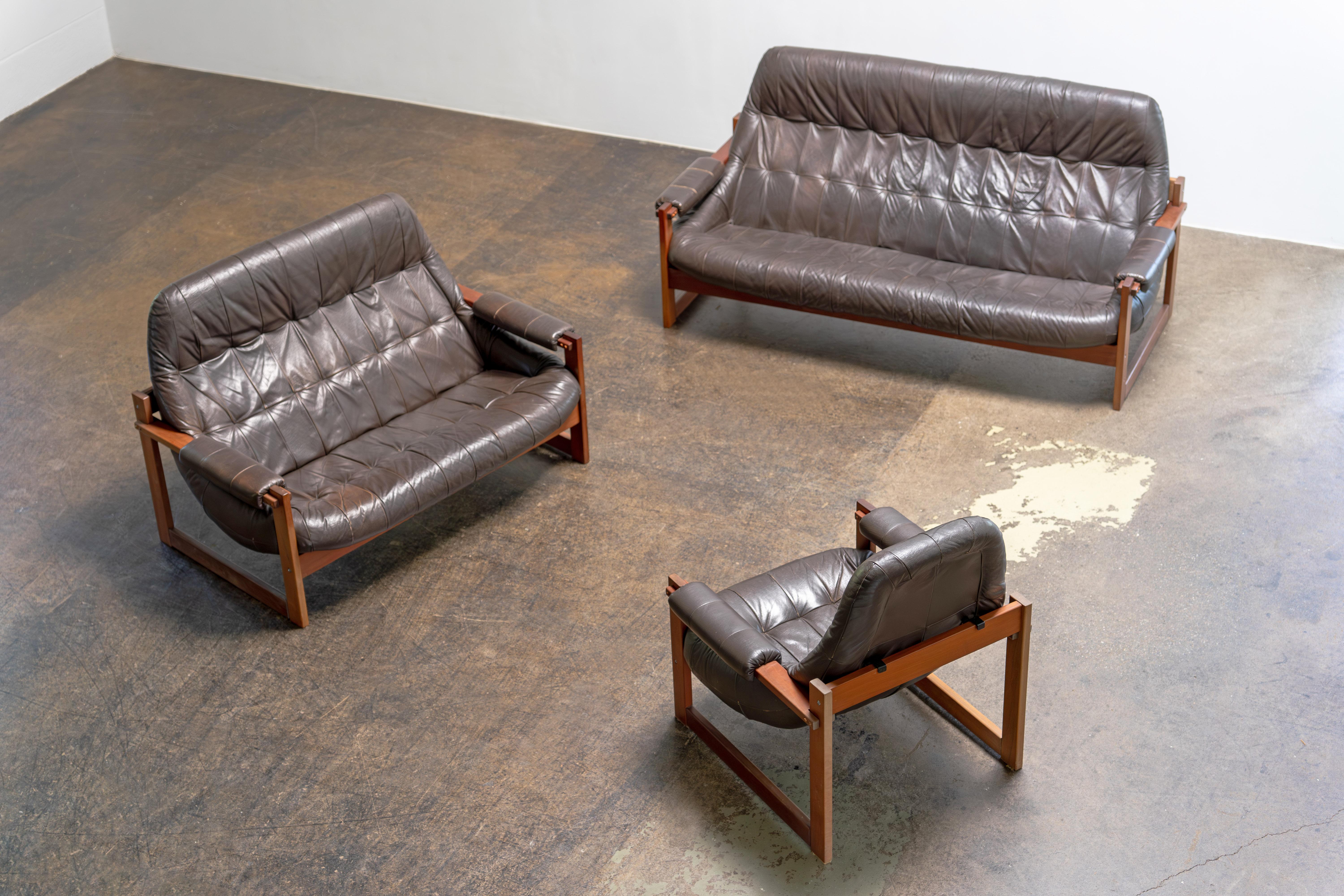 Sofas by Percival Lafer
Brazil, 1970s

Original seating group by Percival Lafer, Brazil, 1970s – including a three-seater, two-seater, and lounge chair. The sculptural shell design with high backs offers exceptional comfort and support. Crafted from
