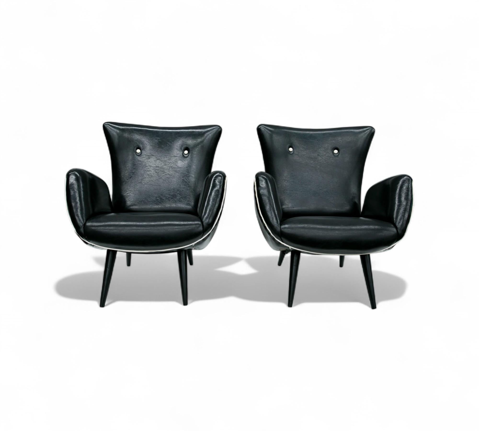 Available today, with domestic shipping in the NYC metro area included, this Brazilian Modern Pair of Armchairs in & Faux Black Leather, Unknown, c. 1950’s, is nothing less than gorgeous!

The frame of these chairs is made with hardwood and the body