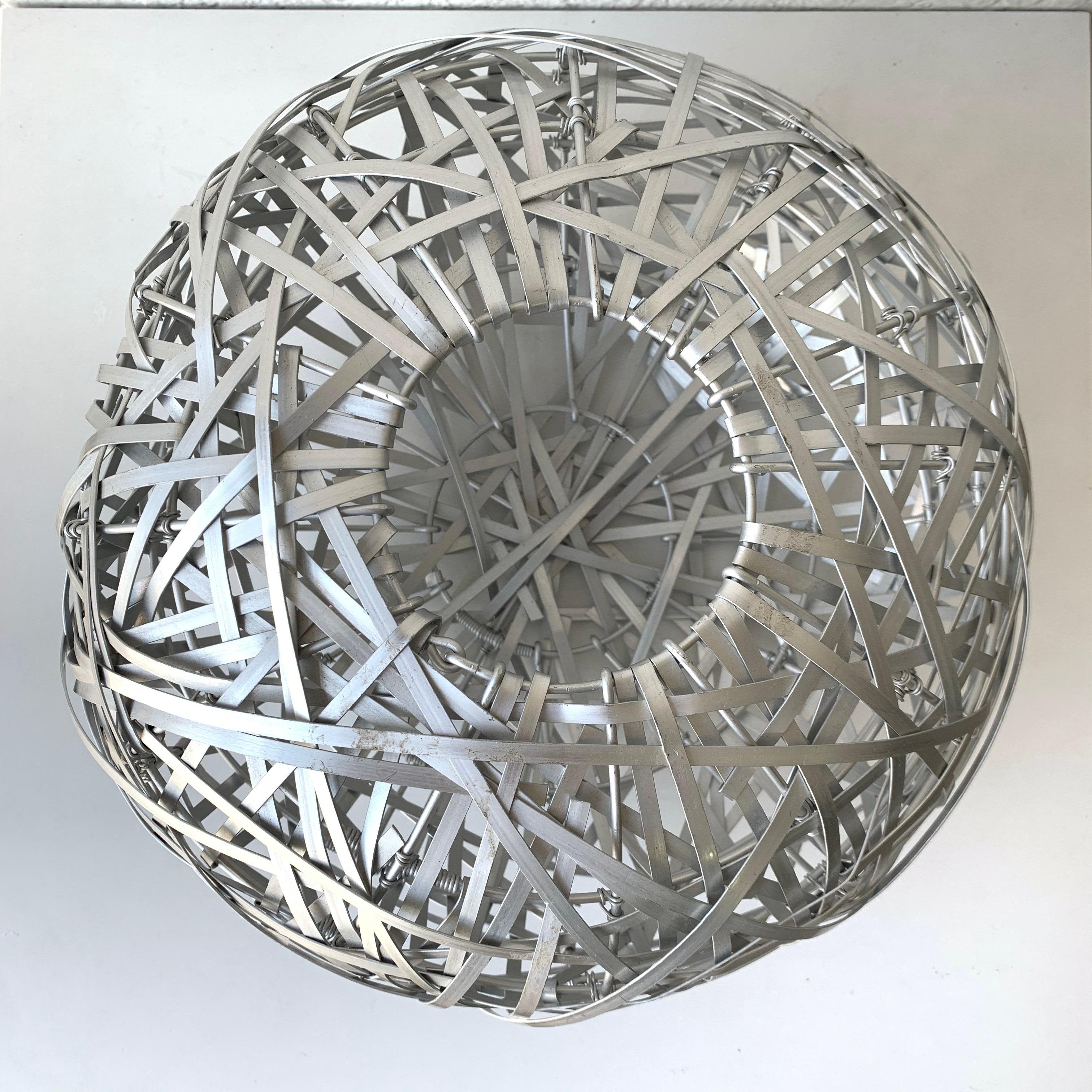 Modern sculptural basket, bowl, vase, or object rendered in woven aluminum, attributed to Humberto and Fernando Campana, Brazil, 1990s.