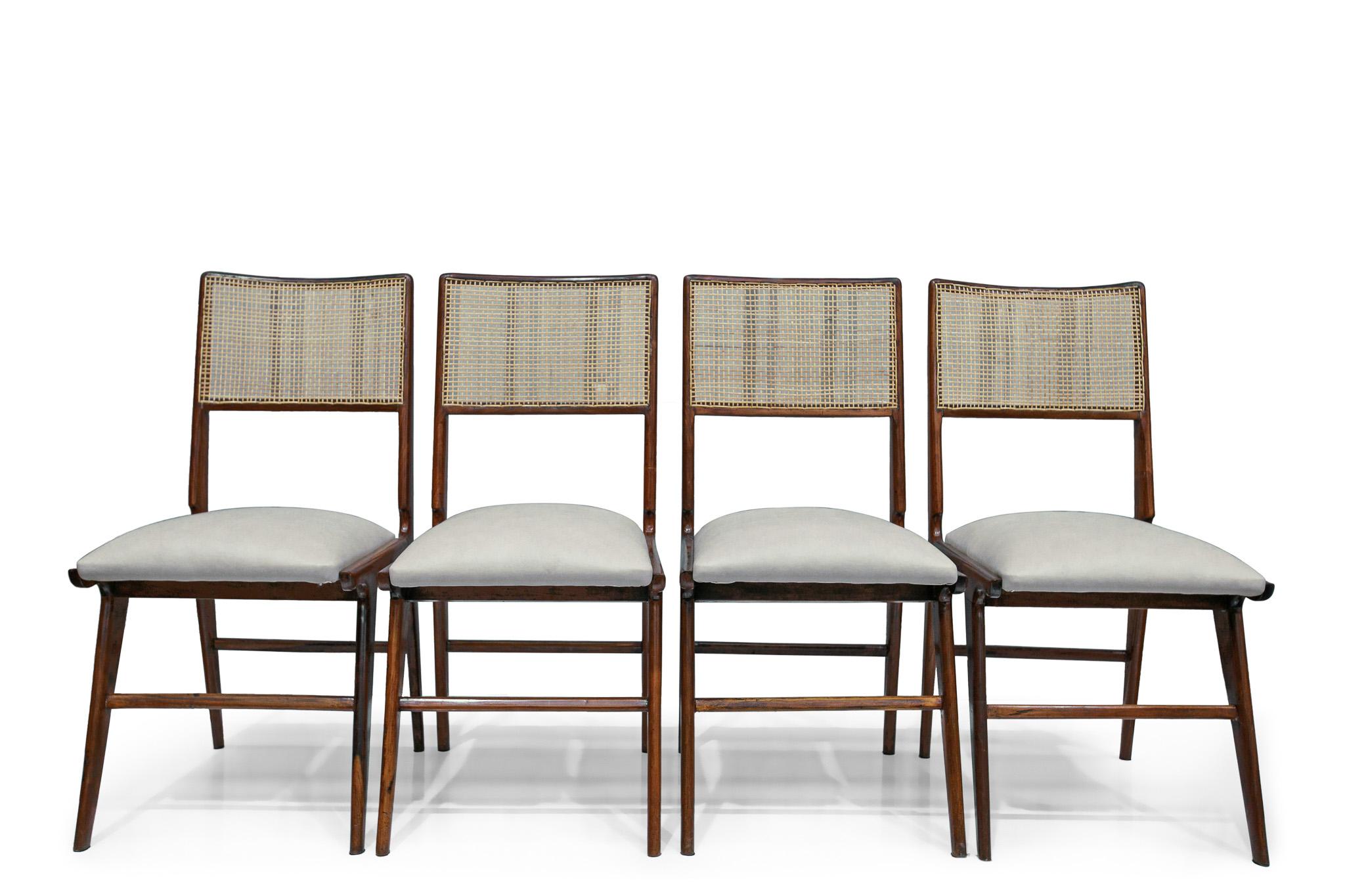 Available today, with domestic shipping in the NYC metro area included, this Brazilian Modern Set of Four Chairs by Carlo Hauner and Martin Eisler, c. 1960s is nothing less than gorgeous!

Crafted from caviuna hardwood, these chairs feature a wooden