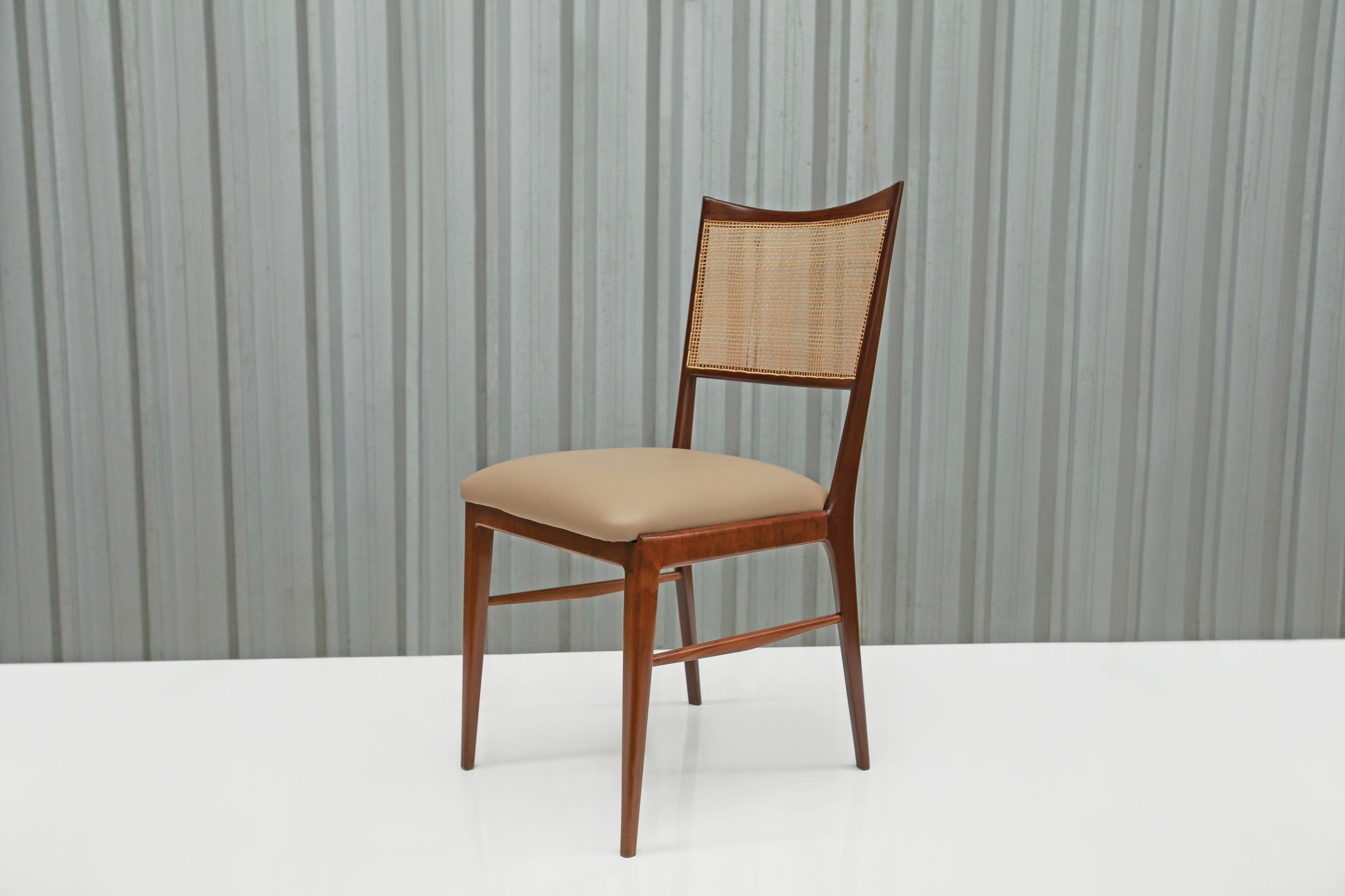Available today in NYC, with free domestic shipping included, these Brazilian Modern Set of Four Chairs in Hardwood & Beige Leather made in the sixties are nothing less than spectacular!

This set comes with four chairs. The frame of the chairs are