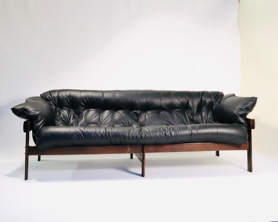 We have just reupholstered this gorgeous sofa with super soft black leather.

This is a much loved and iconic design by Percival Lafer. This sofa encapsulates the spirit of Brazilian Mid-Century Modern. Created in the 1960s in solid Pau Ferro wood