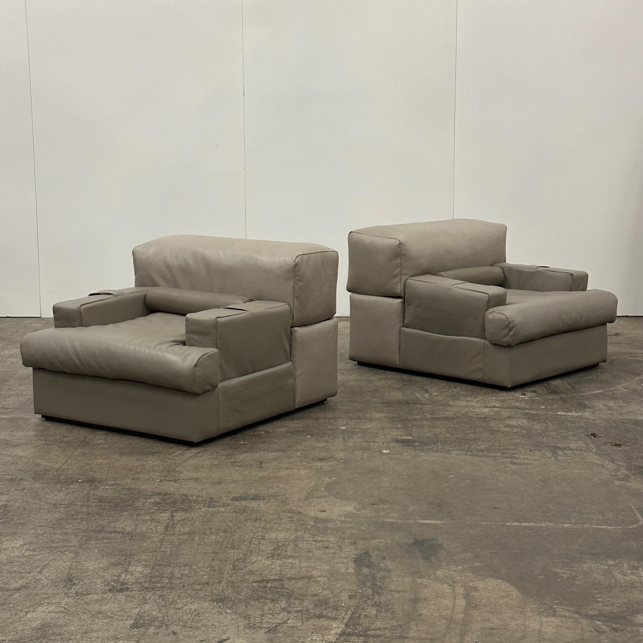 c. 1970s. Price is for the set. Contact us if you’d like to purchase a single item. Set of three adjustable armrest sofa/chairs, fully reupholstered in gradient grey tonal leather. Each section matches the same section on the other pieces, but the