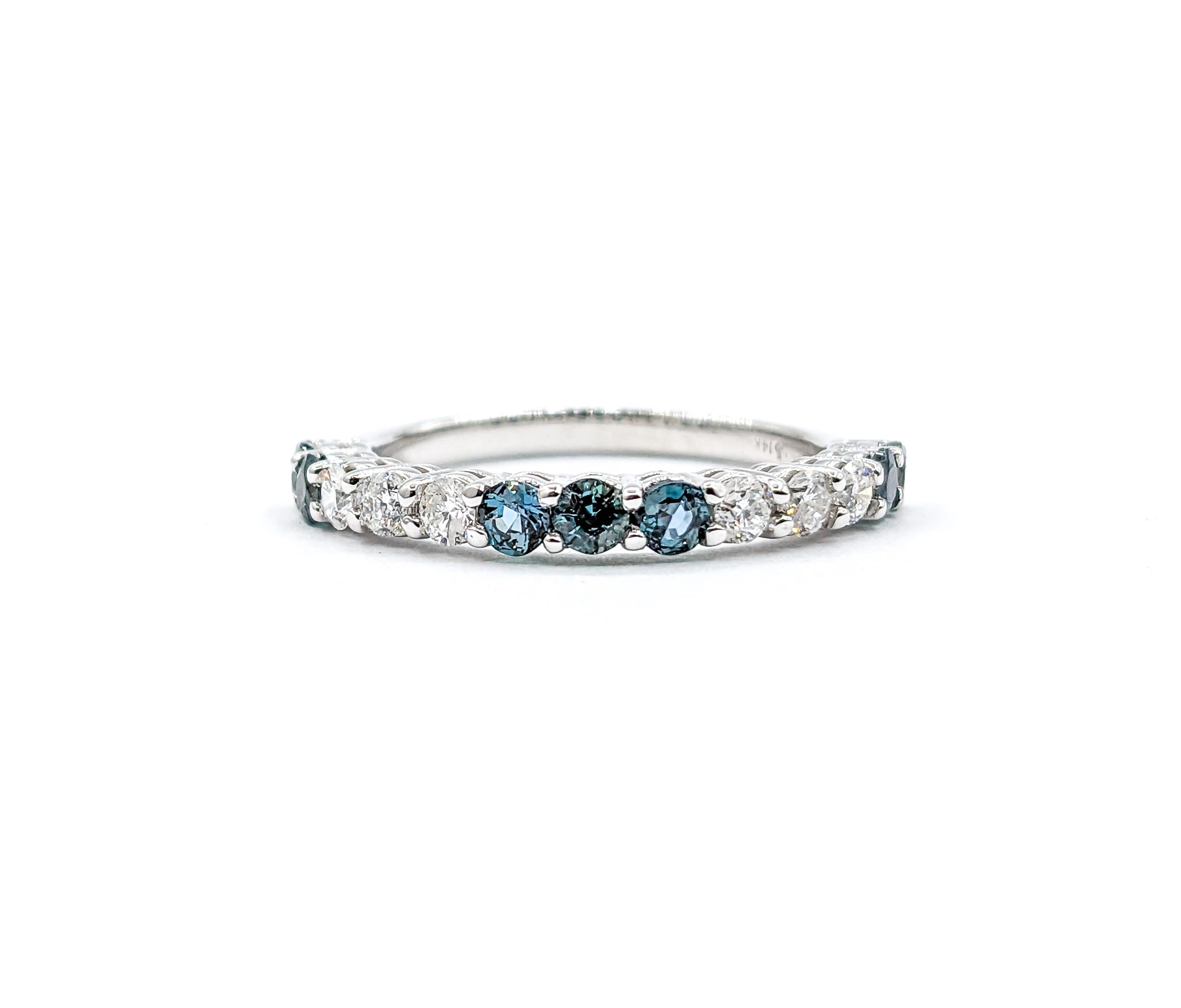 Brazilian Natural Alexandrite & Diamond Color Change Band Ring in White Gold

Presenting an exquisite ring, elegantly crafted in 14k white gold, adorned with a captivating band of .31ctw round diamonds that shimmer with unparalleled brilliance.
