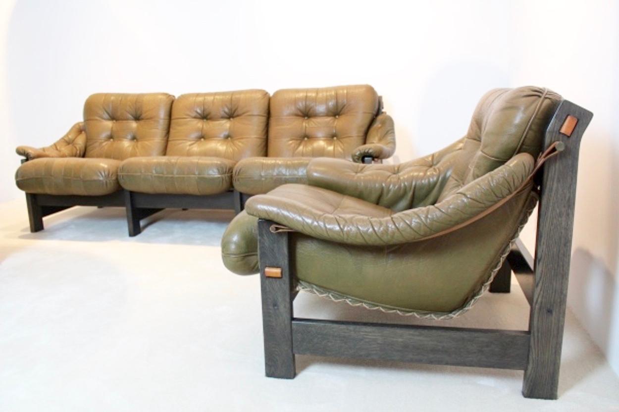 A wonderful original matching 1970s Brazilian seating group attributed to Jean Gillon. This amazing comfortable 3-seat and two 1-seat have a unique washed dark-grey oak frame and soft Brazilian leather cushions in dark brown-olive variety with