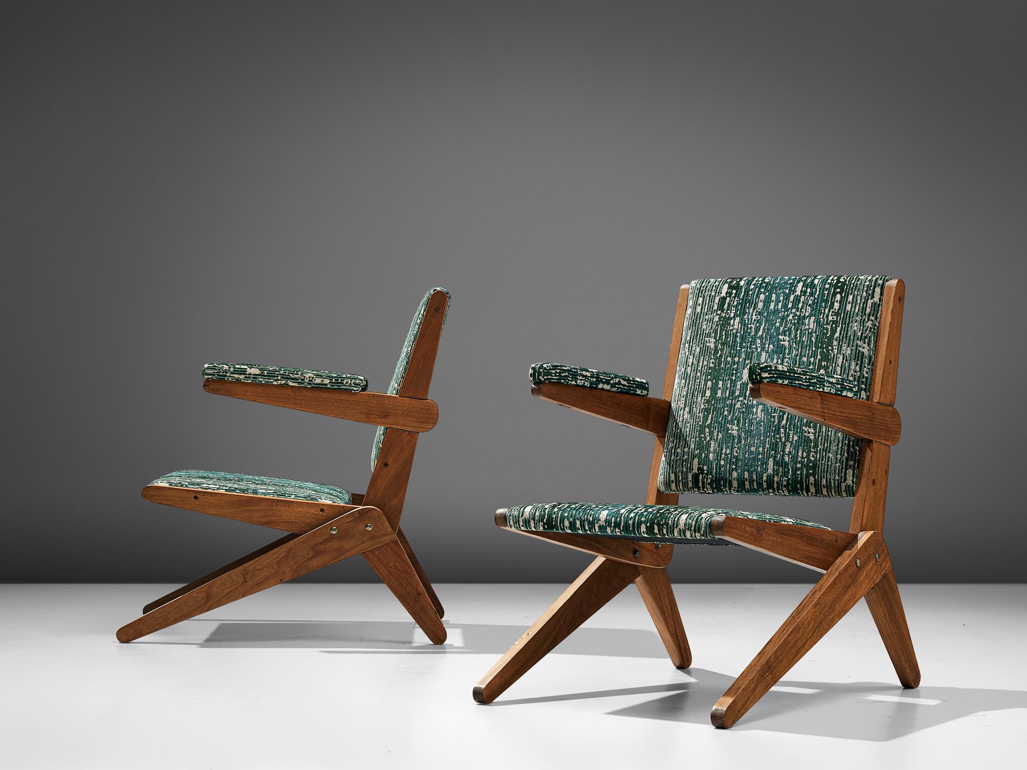 Pair of scissor armchairs, Brazilian hardwood and fabric, Brazil, circa 1950

These exceptionally rare armchairs from Brazil embraces the quintessential Brazilian ethos of the 1950s. The design bears the beauty of Brazil's natural environment