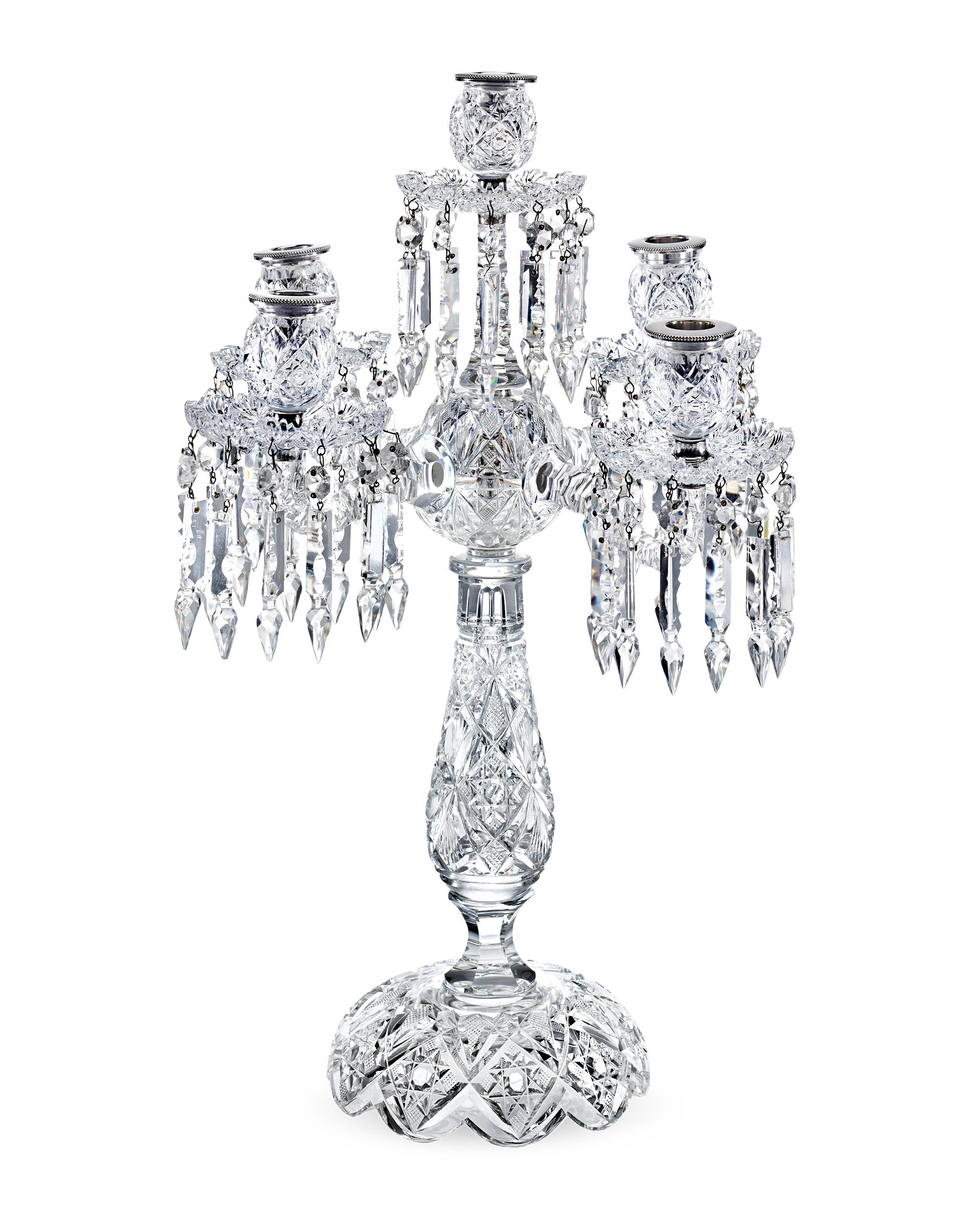 These exceptionally rare American Brilliant Period Brazilian pattern cut glass four-arm candelabra were crafted by the renowned T.G. Hawkes & Co. The Brazilian motif is one of the most intricate and visually appealing American Brilliant Period cut