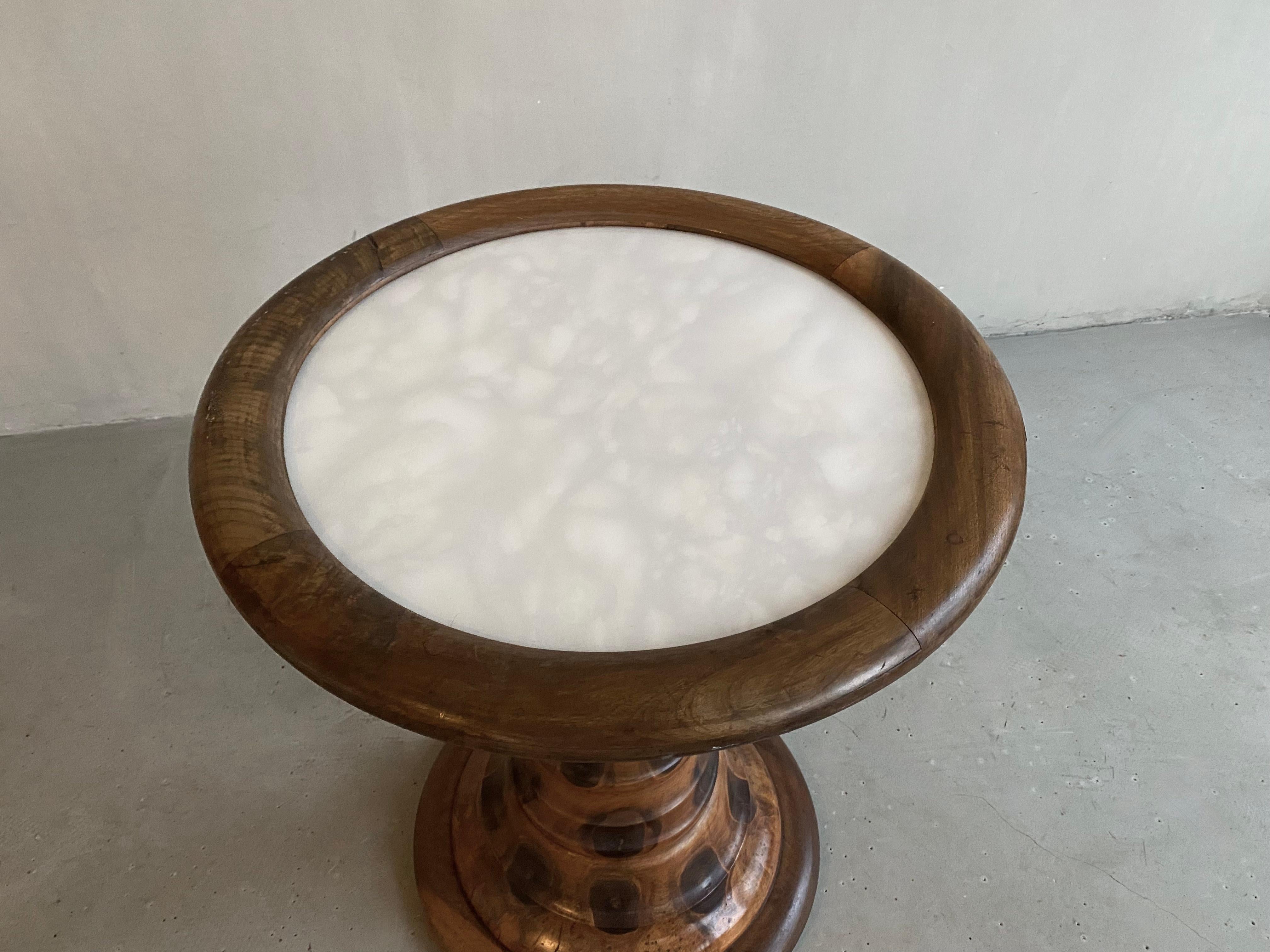 Unusual Brazilian monkey wood Pedestal table with a beautiful Italian Carrara like top under glass.
A tapering vintage table and circular platform base. Unique!

Labeled by maker 