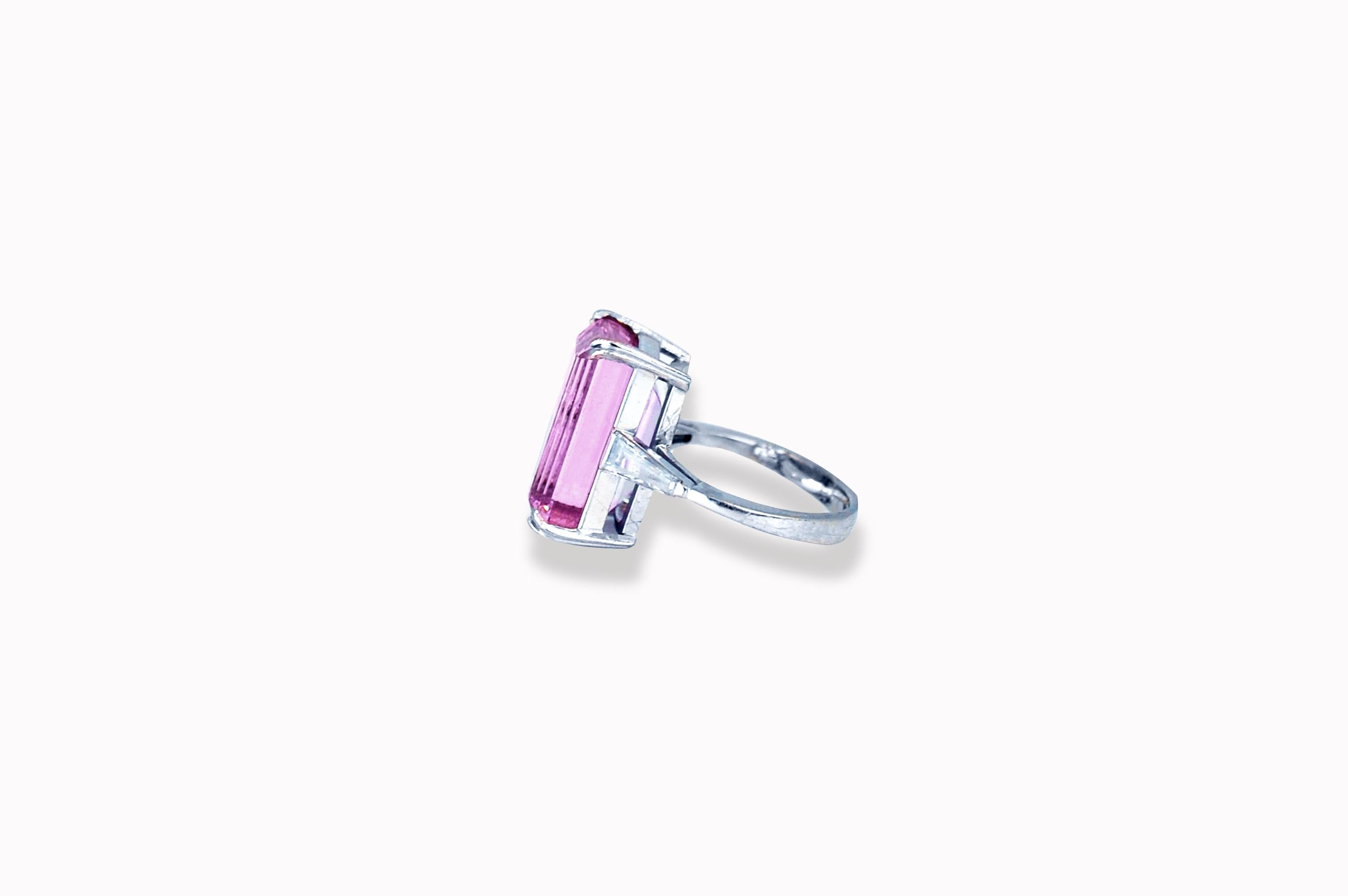 This ladies Pink Imperial Topaz in truly one-of-a-kind.  The center stone is unlike nothing most jewelers have seen let alone jewelry collectors.  The center stone is a Brazilian pink imperial topaz that measures 16.8 x 10.6 x 9.8 mm.  The approx.