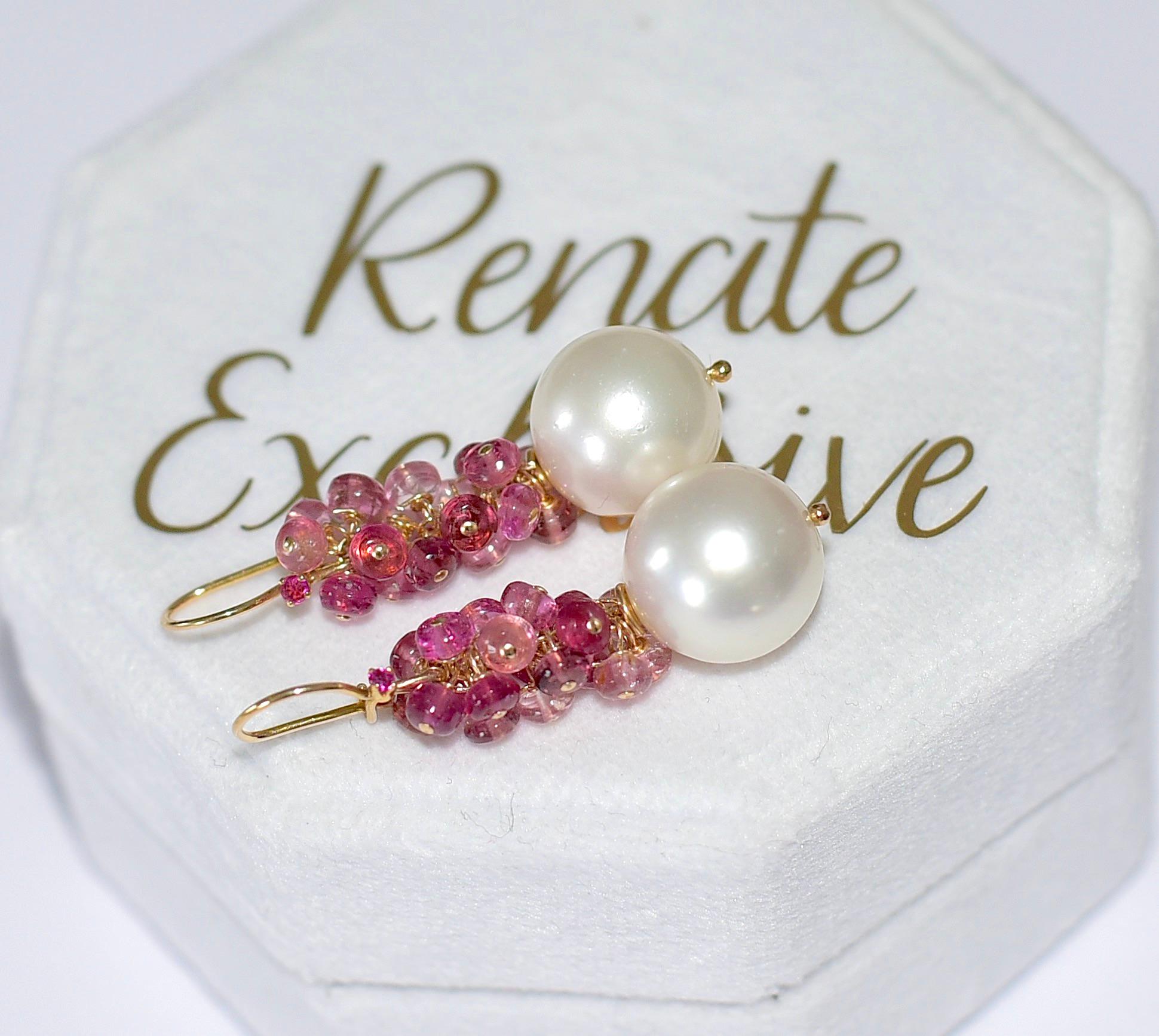 Lovely 13,5mm South Sea Pearl earrings with a touch of the deep color of a ruby! Decidedly elegant pearl earrings with Brazilian Rubelite Tourmaline beads. Elegant, artistic, and unique style!  Nobody has this! 
Earring 14K Solid Yellow Gold with