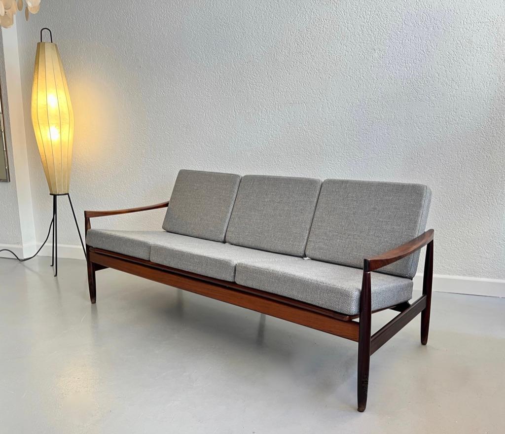 Elegant Brazilian rosewood 3 seater sofa manufactured by Skive Møbelfabrik and attributed to Kai Kristiansen, Denmark, circa 1950s
Rosewood structure in very good condition, cushions reupholstered in light grey wool, new foam.
Engraved Made in