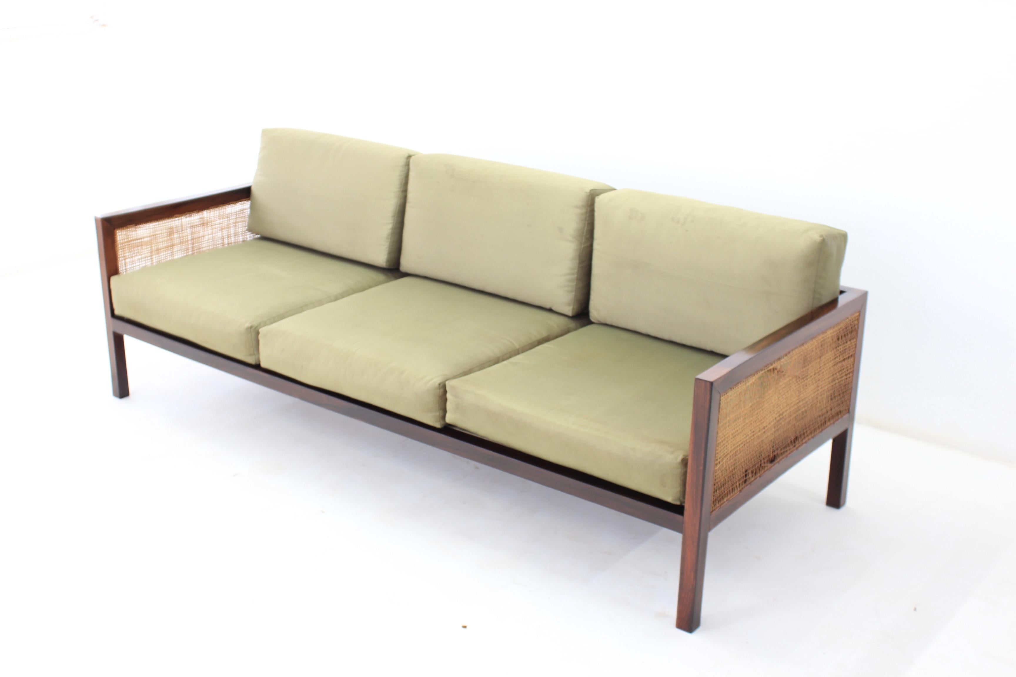 Sofa in Brazilian rosewood and cane.