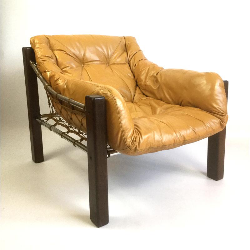 Leather armchair in solid Brazilian rosewood (Jacaranda)
Designed by Jean Gillon for Italma Wood Art, Brazil
chrome-plated frame and rope canvas seat 
The original leather cushion has been newly restored and resprayed in its original color by a