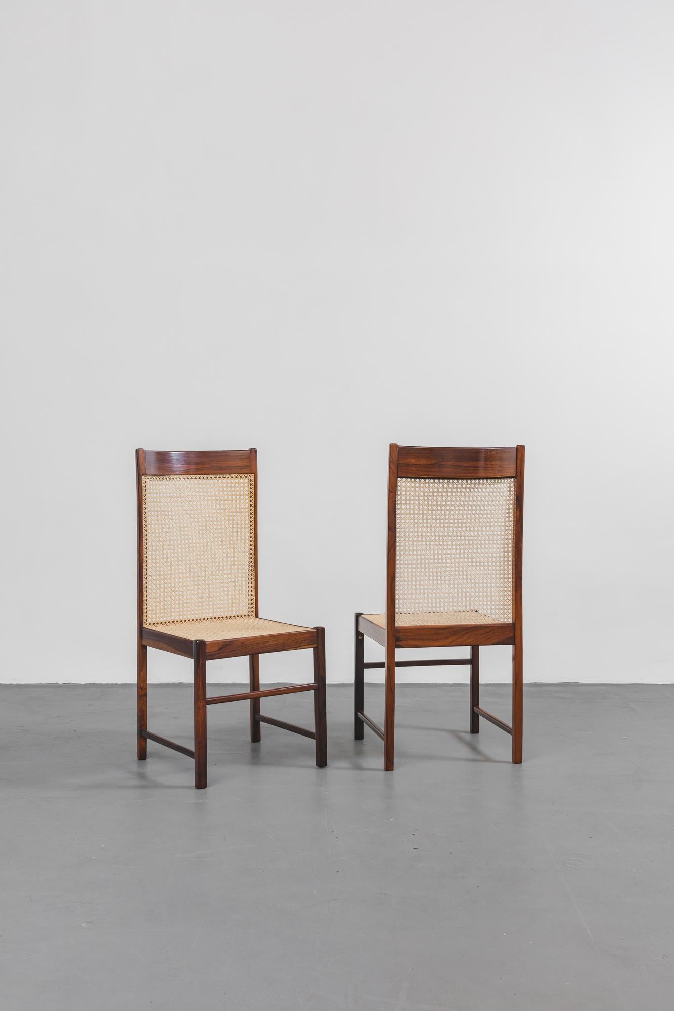 Designed by FAI, modern Brazilian chairs made of Rosewood, with nubby fabric. 
Made in Brazil, in the 1960s. 

Chairs made in solid Brazilian Rosewood (Jacaranda) with caned seats and backs. 

”Fatima Arquitetura Interiors,” known as ”FAI”, was