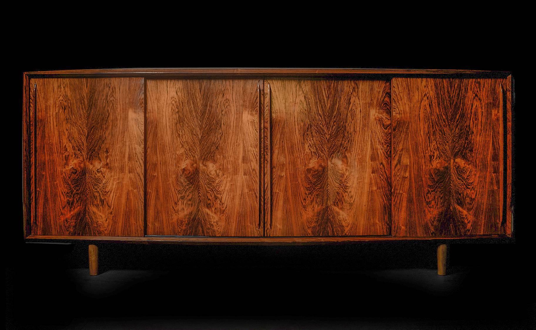 An exemplar of elegant simplicity, crafted in Brazilian rosewood with handsomely refined lines and meticulous joinery, executed with an expert level of craftsmanship. Beautiful rich tones and patina. This is a timeless piece with excellent