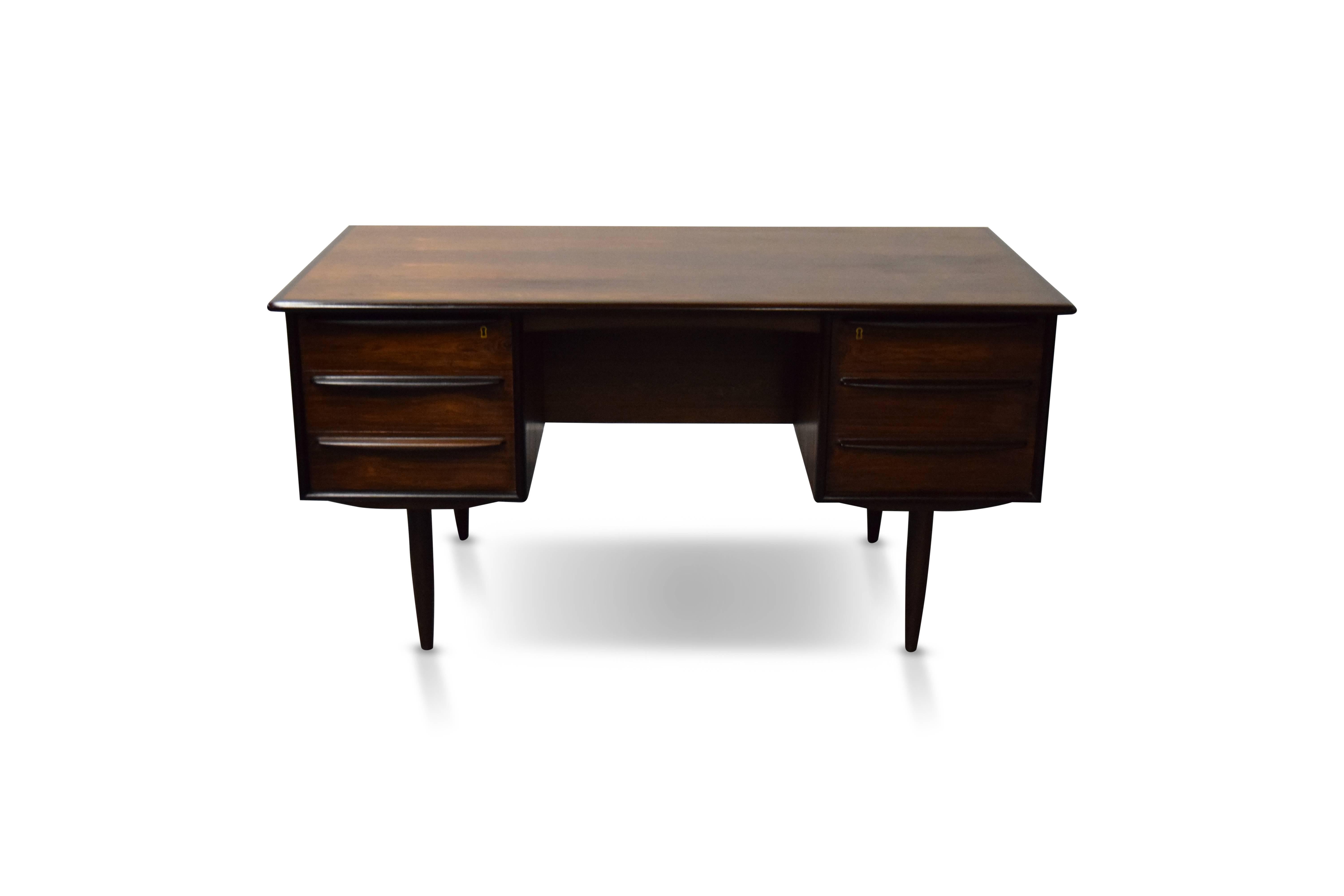 Brazilian rosewood Danish desk by Falster.

Desk comes with the two original brass keys.