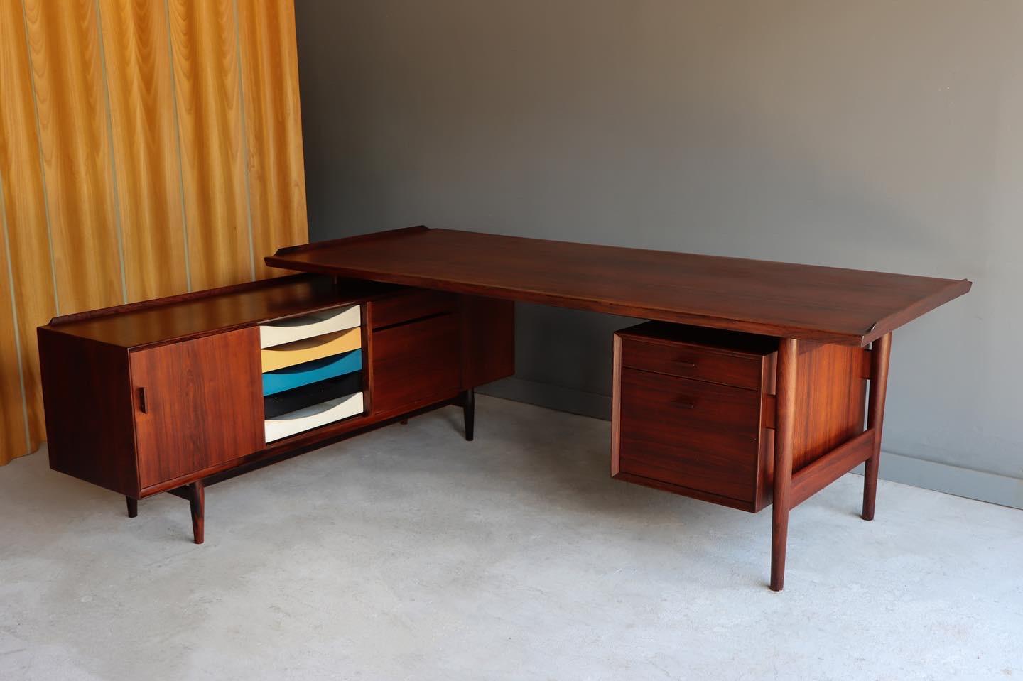 Stunning desk and integrated sideboard - Designed by Arne Vodder and produced by Sibast Møbelfabrik - Denmark c. 1955. This beautiful design is made completely of the finest Brazilian rosewood and still retains it’s beautiful coloring and graining.