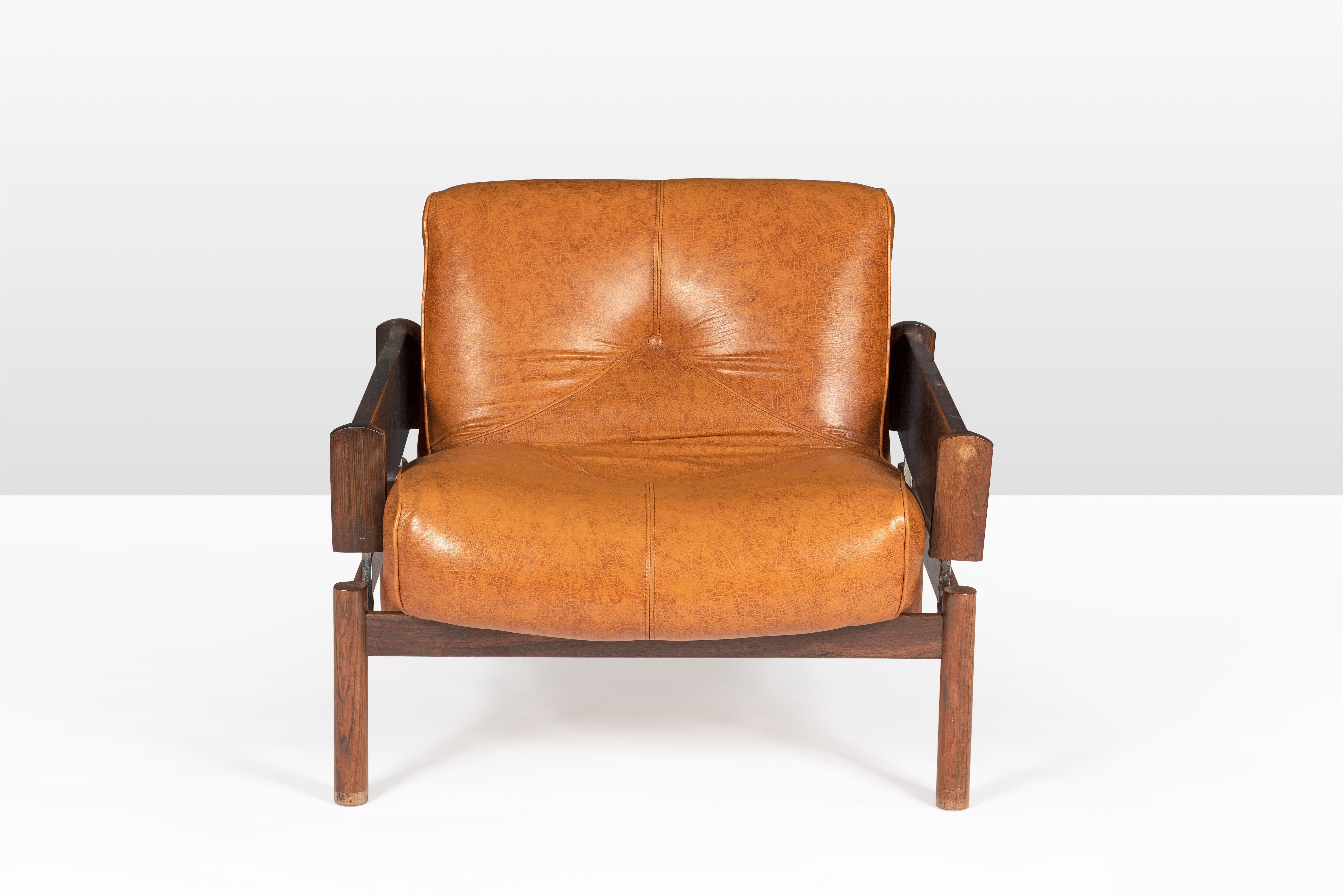 Percival Lafer super comfortable Mid-Century Modern lounge chairs made of Brazilian mahogany and still with it's original faux leather upholstery.  Seating height is 41 cm. 