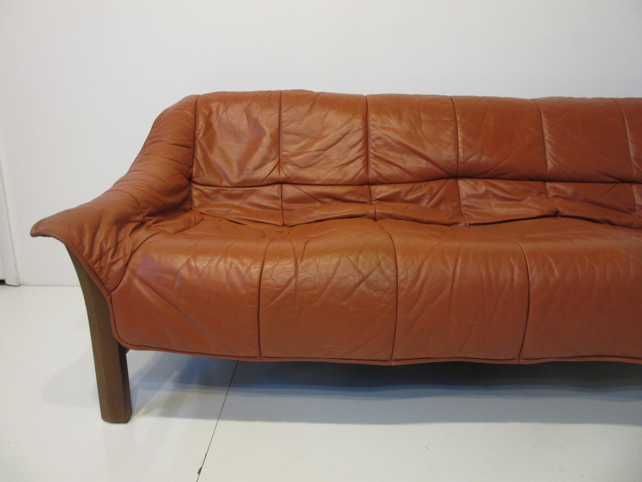 A leather sofa with a solid Jacaranda rosewood frame, this super comfortable piece is perfect for the living space that needs a rich but relaxed look. Well-made and with heavy leather which is great for long term wear manufactured in Brazil.
