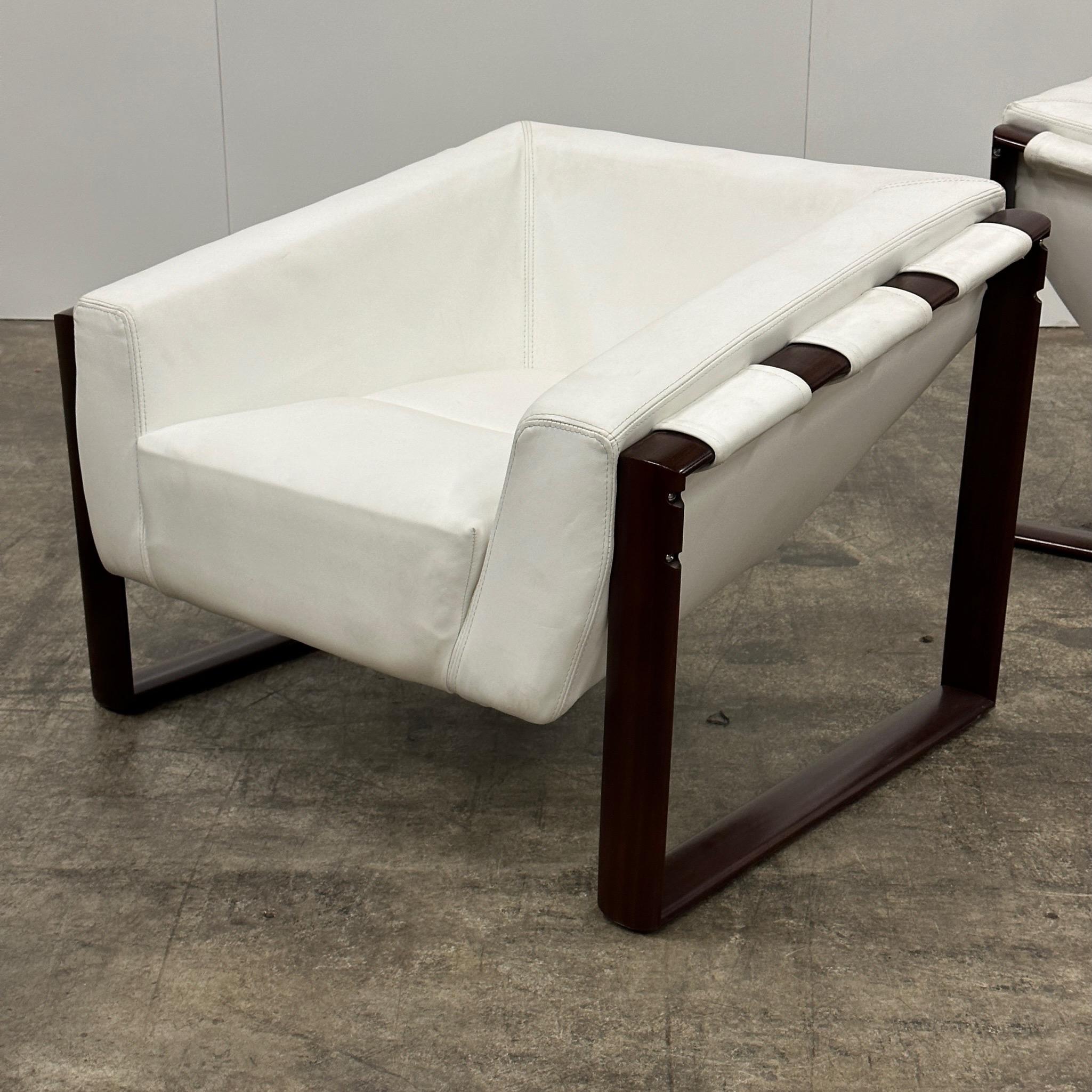 c. 1960s. Previously reupholstered in white leather. Rosewood frames. Foam is hard.

Price is for the set. Contact us if you’d like to purchase a single item.

