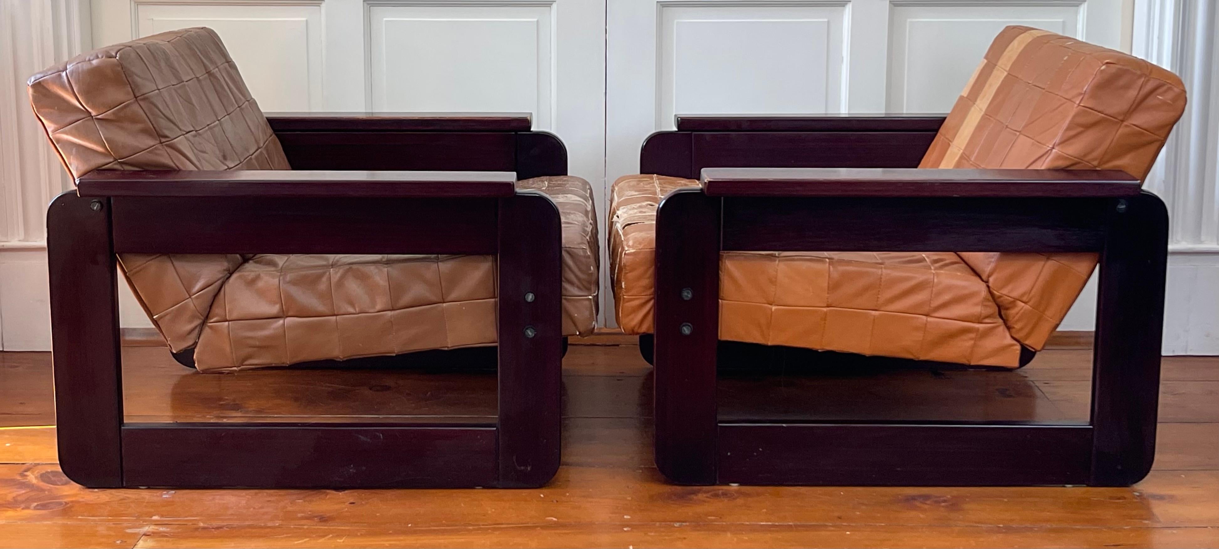 These classic Brazilian modern armchairs by Percival Lafer are being sold for their stunning rosewood frames with original hardware as the leather seat cushions are likely worn/damaged beyond repair. Bring these beauties back to life for the
