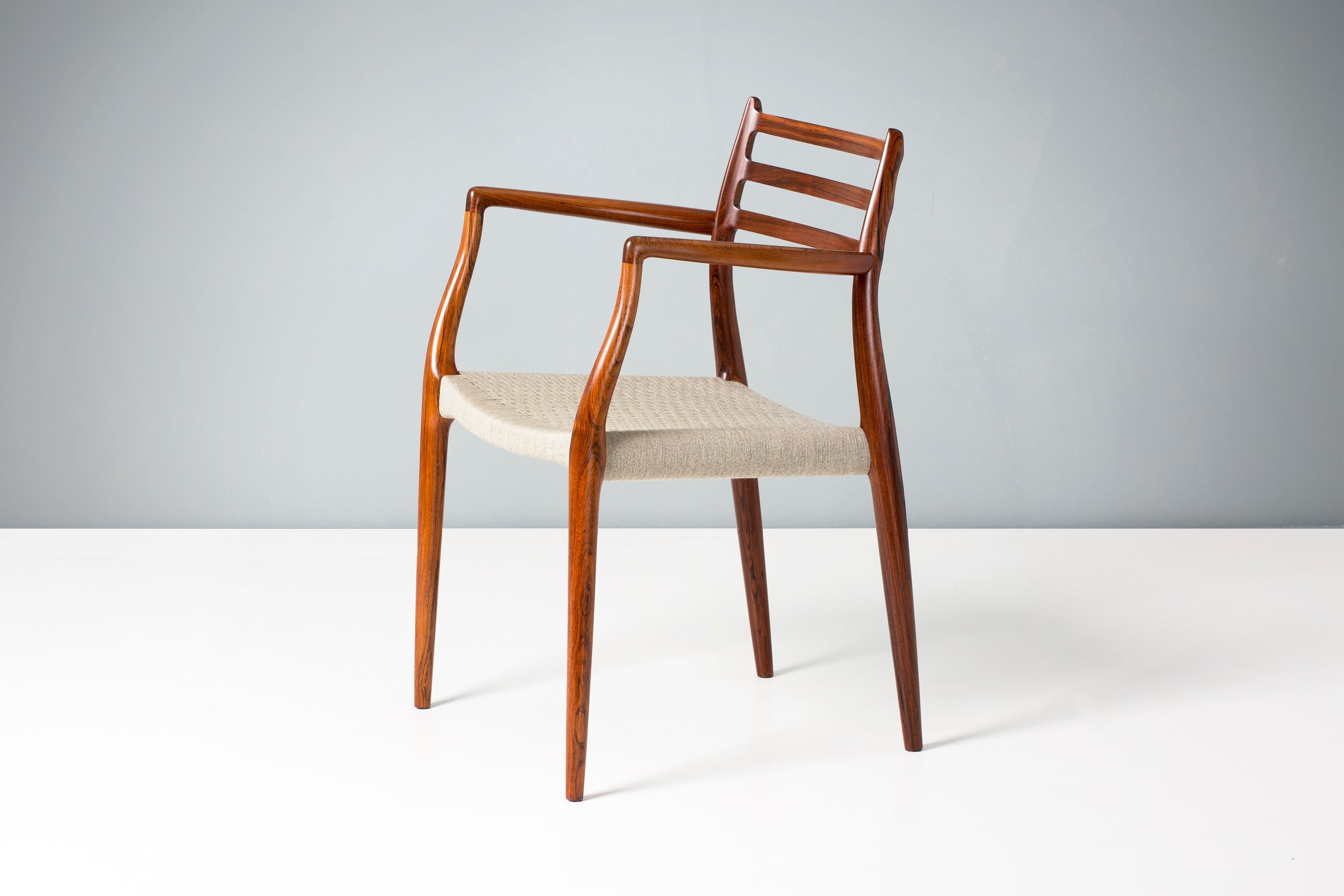 Niels Moller

Pair of model 62 armchair, 1962.

Rarely seen edition of this iconic design made from exquisite, highly figured Brazilian rosewood. Designed by Niels Moller for his own company: J.L. Moller Mobelfabrik in Denmark in 1962, the Model