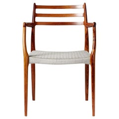 Fauteuil en bois de rose brésilien Modèle 62 de Niels Moller:: 1962