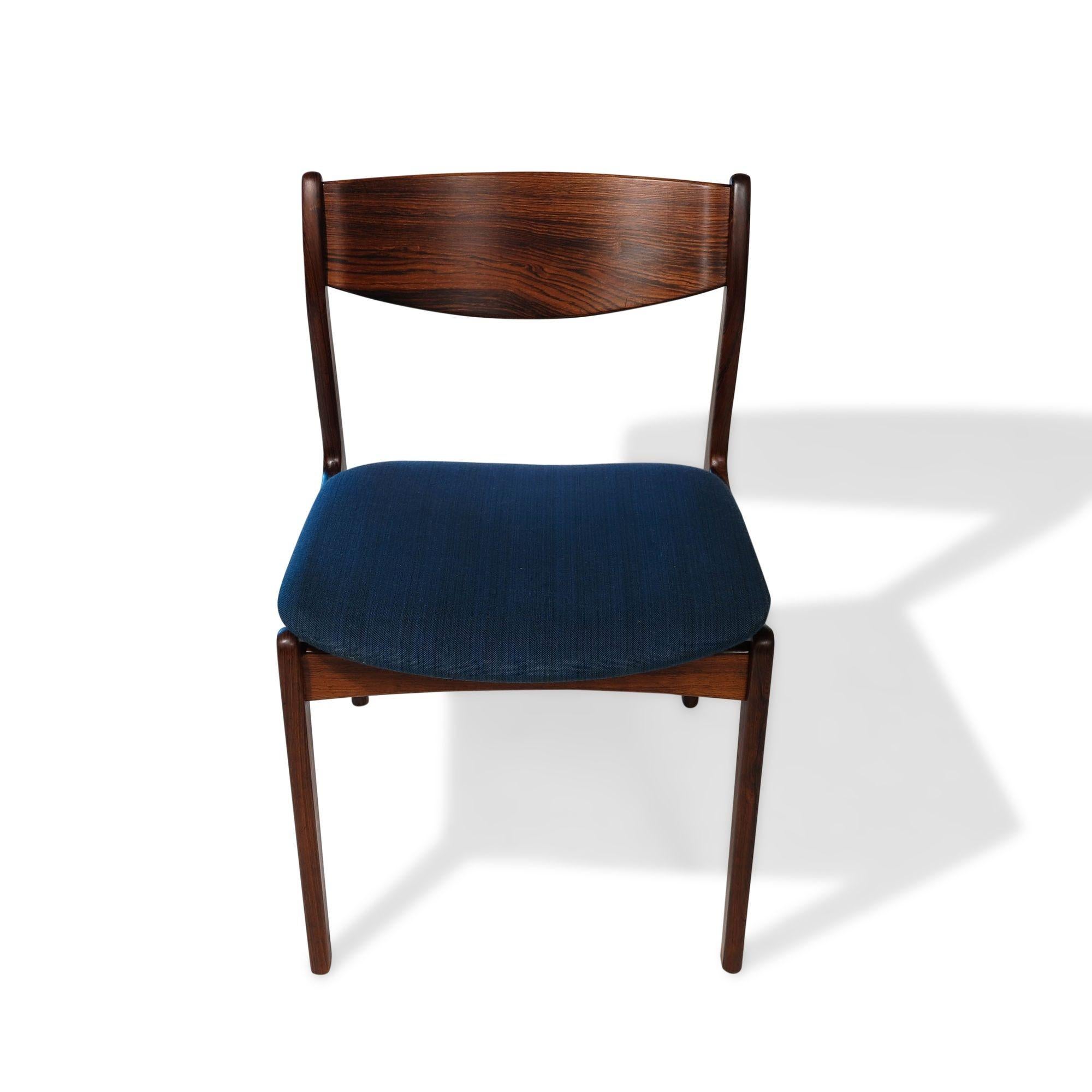 Set of six mid-century Danish dining chairs designed by P.E. Jorgensen for Farso Stolefarik, 1955, Denmark. The chairs are crafted of Brazilian rosewood with dark figured grains, comfortable backrests, and upholstered in the original blue wool