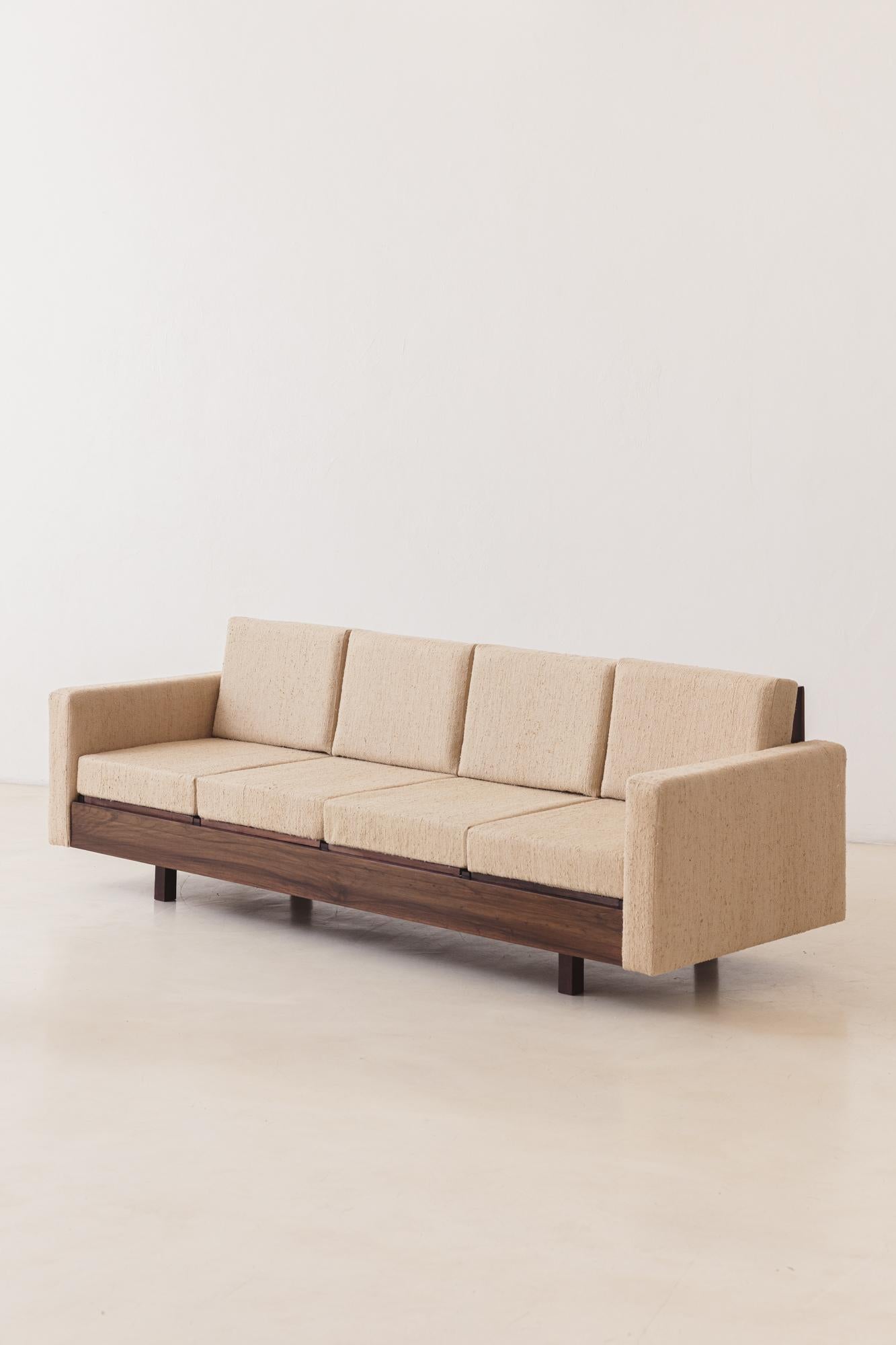 This sofa was produced by the Brazilian company Celina Decorações in the 1960s. The sofa is made of solid Rosewood, with seats and backs upholstered with a gorgeous fabric 100% Organic Silk, from our collection Bossa Fabrics. 

The armrests have a