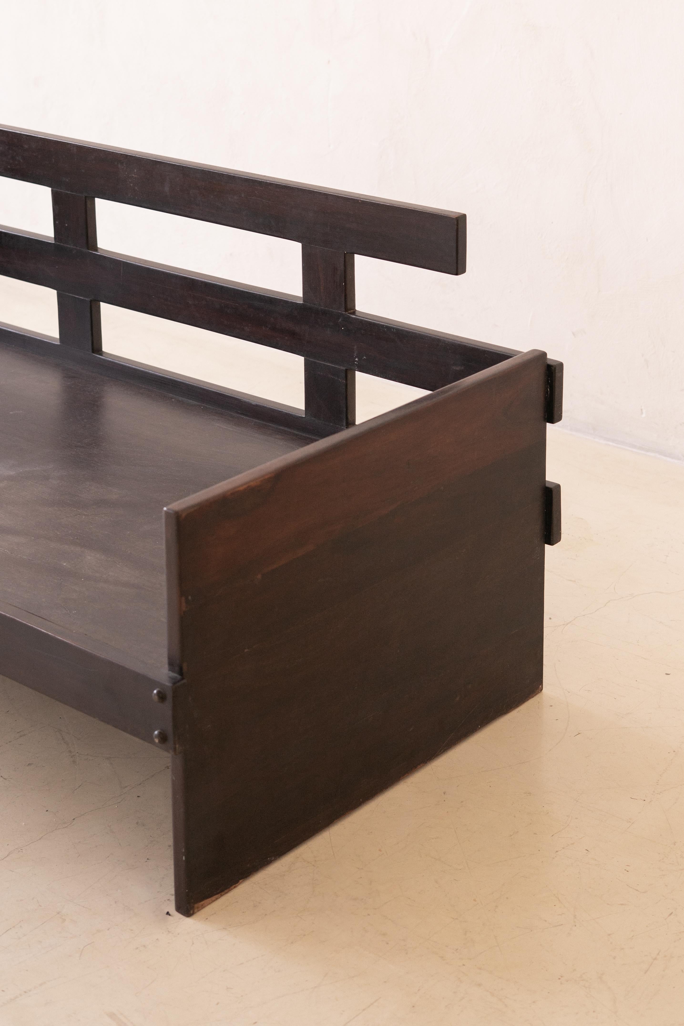 This Sofa was produced by the Brazilian company Celina Decorações in the 1960s.

The armrests have a rectangular design that favors the visualization of the wood’s beautiful veins, with upholstered sides. The base consists of four rectangular legs,
