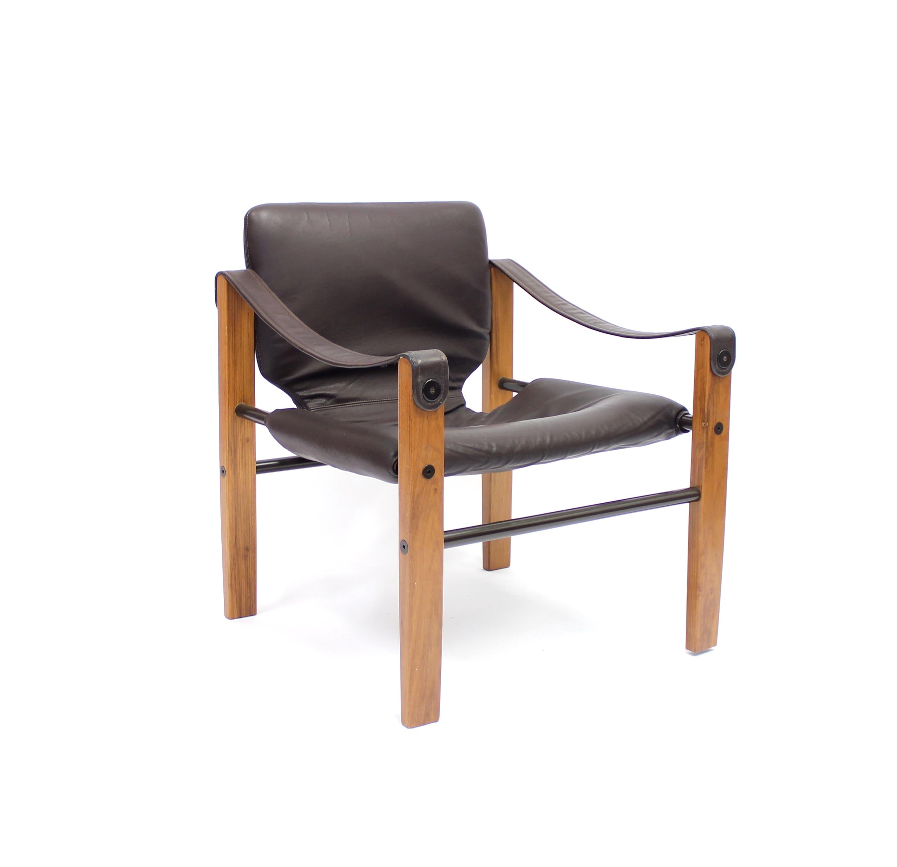 This safari chair, model Chelsea, by Maurice Burke was produced in Brazil in the 1960s and contains its original leather that sits on a teak frame with tubular steel details. Very good condition with light ware consistent with age and use.