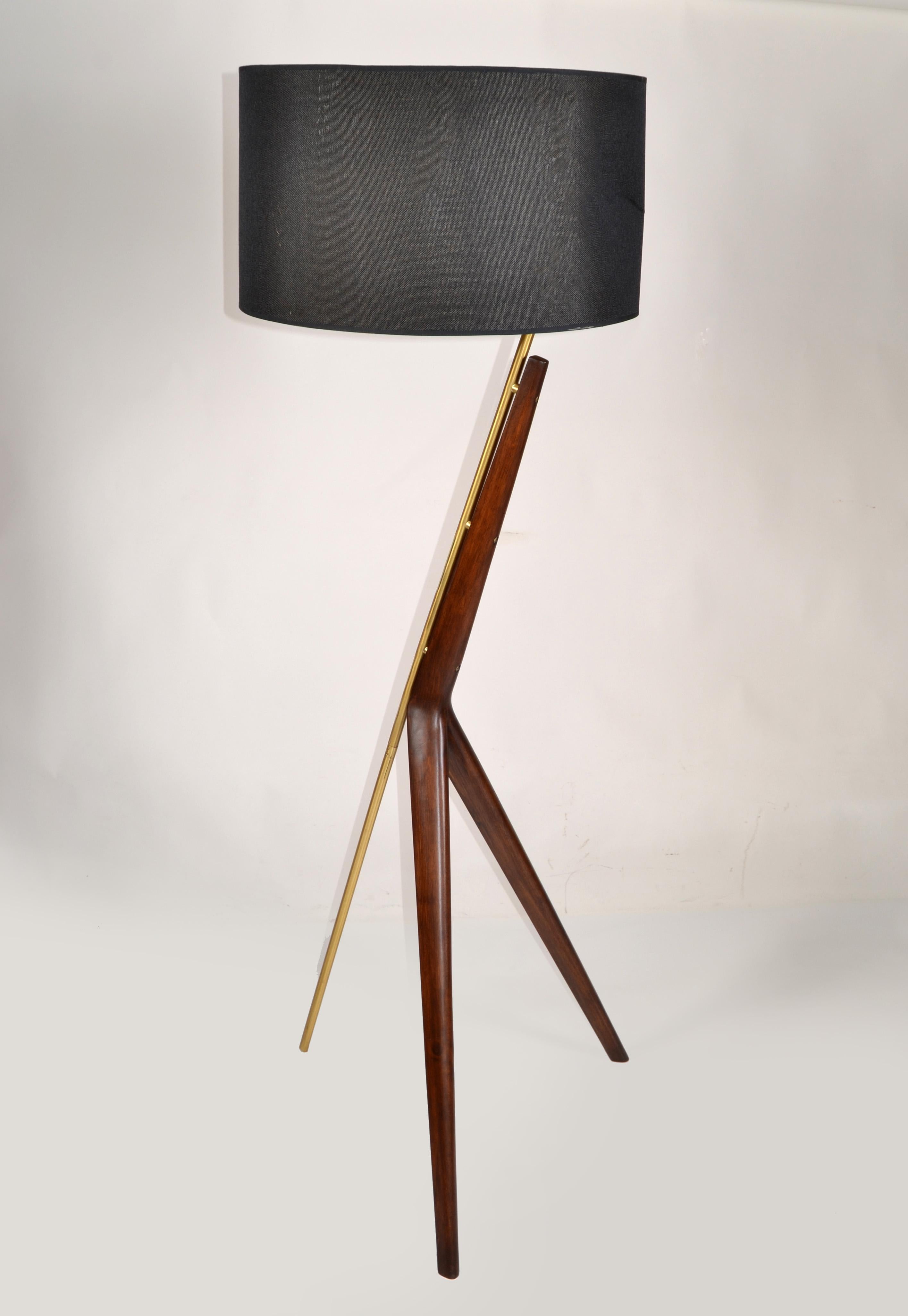 Mid-Century Modern Brazilian sculpted bold angles of design Floor Lamp.  Designed with a striking tripod base that's crafted from solid Walnut Wood and accented with antique-brass finished metal.
It can be complemented by a large Linen Lamp Shade
