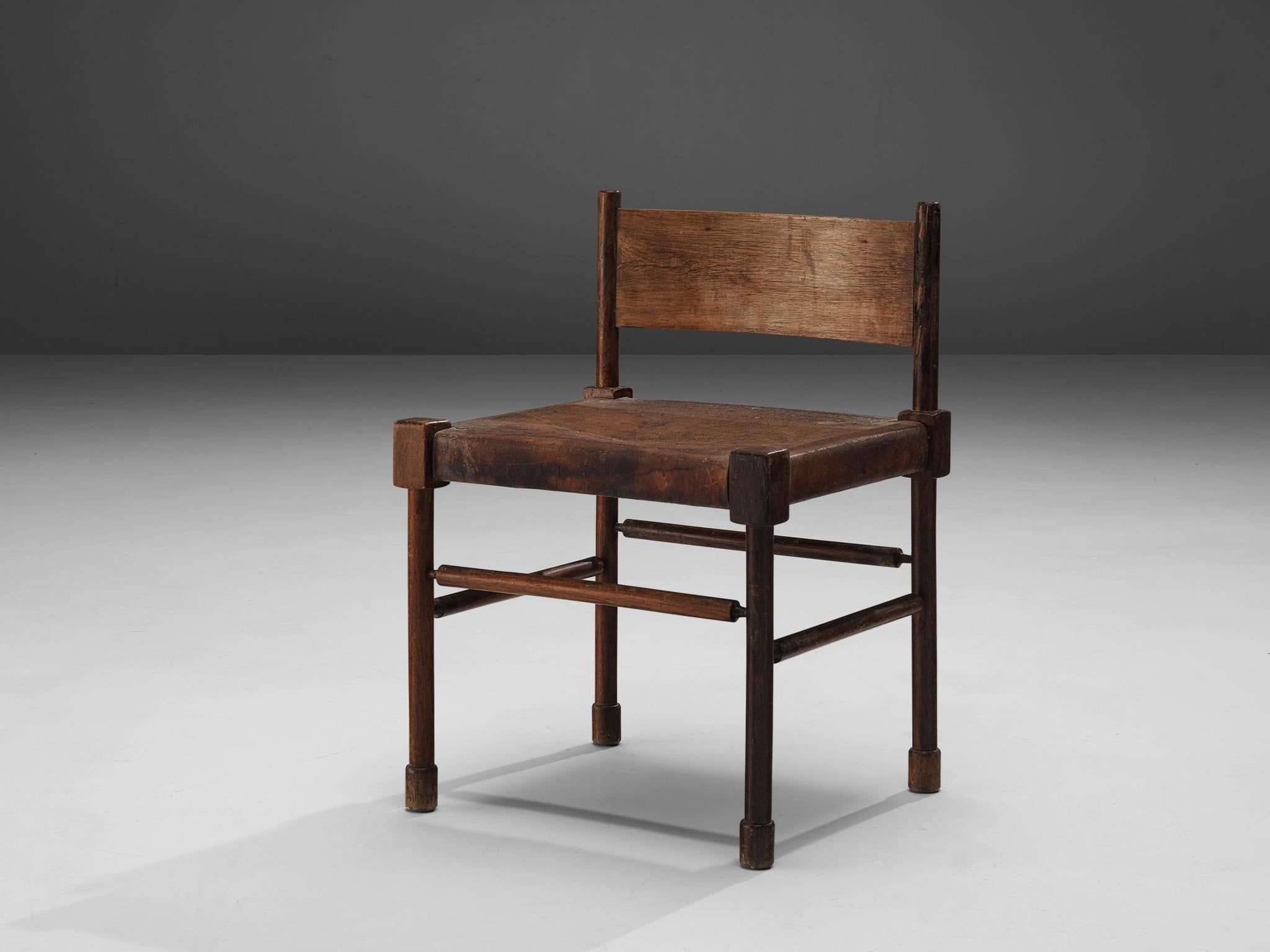 Side chair, stained wood, patinated leather, Brazil, 1940s

Rare side chair with sculpted frame in stained wood and leather seat. What makes this design so unique is the way the designer played with proportions and shapes. The detailed carved frame
