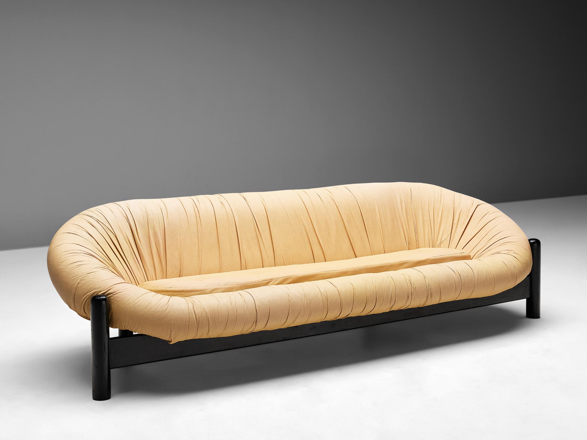 Sofa, lacquered wood, leatherette, Brazil, 1970s.

Monumental and post modern sofa made in Brazil in the 1970s. This sofa consists of a large frame and seat out of one piece, upholstered with light yellow leatherette. The seat has a tufted pillow