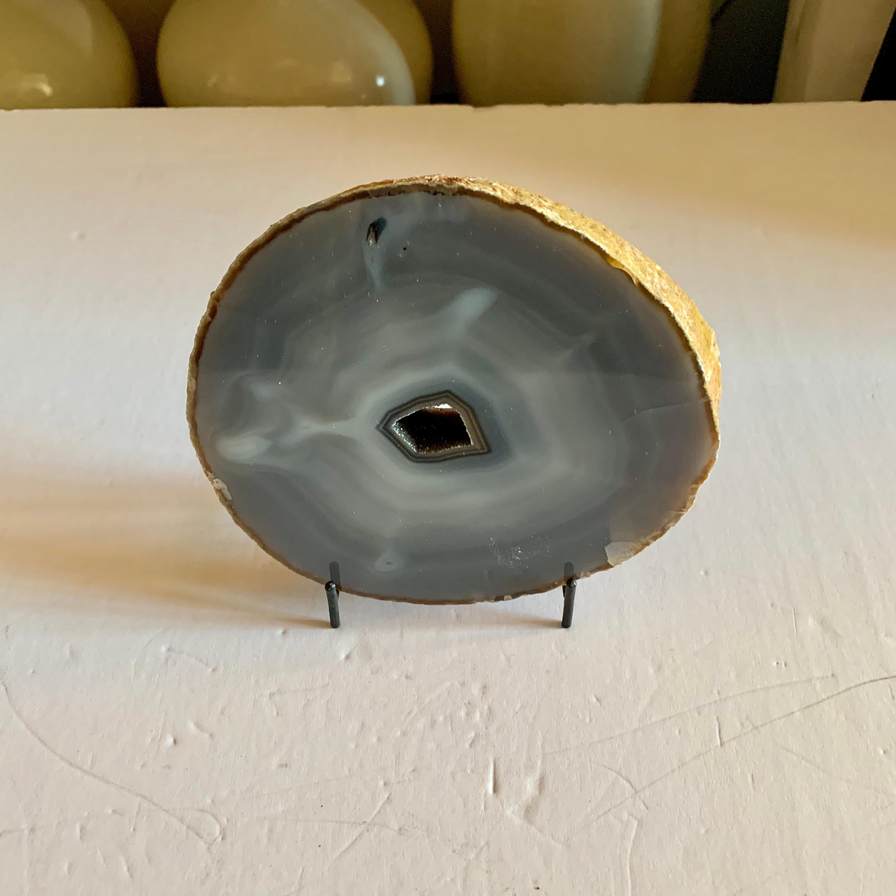 Brazilian sliced agate sculpture
Concentric circles of grey color with hollowed centre
One of several pieces from a large collection of agate.