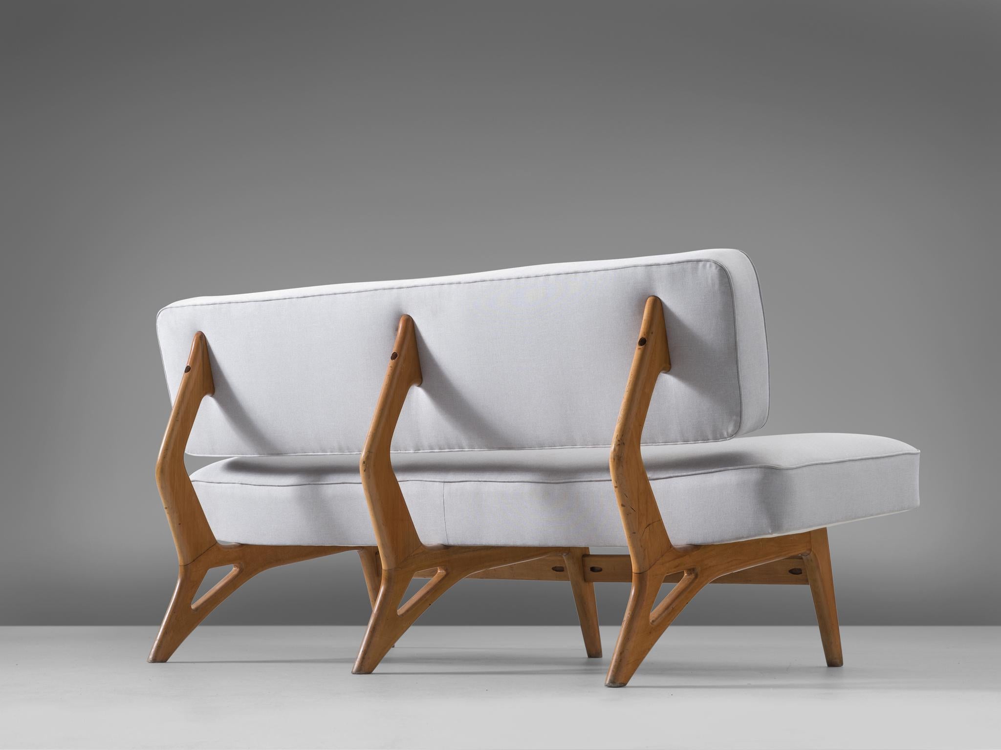 Móveis Cimo, sofa, maple and fabric, Brazil, 1950s.

Small curved sofa with organic shaped maple base. Eye-catching element is the wooden frame. This organic shaped frame is divided into three parts, with beautiful rounded edges and curves. The