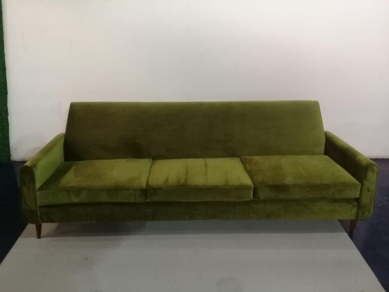 This sofa made by designer has three seats and 