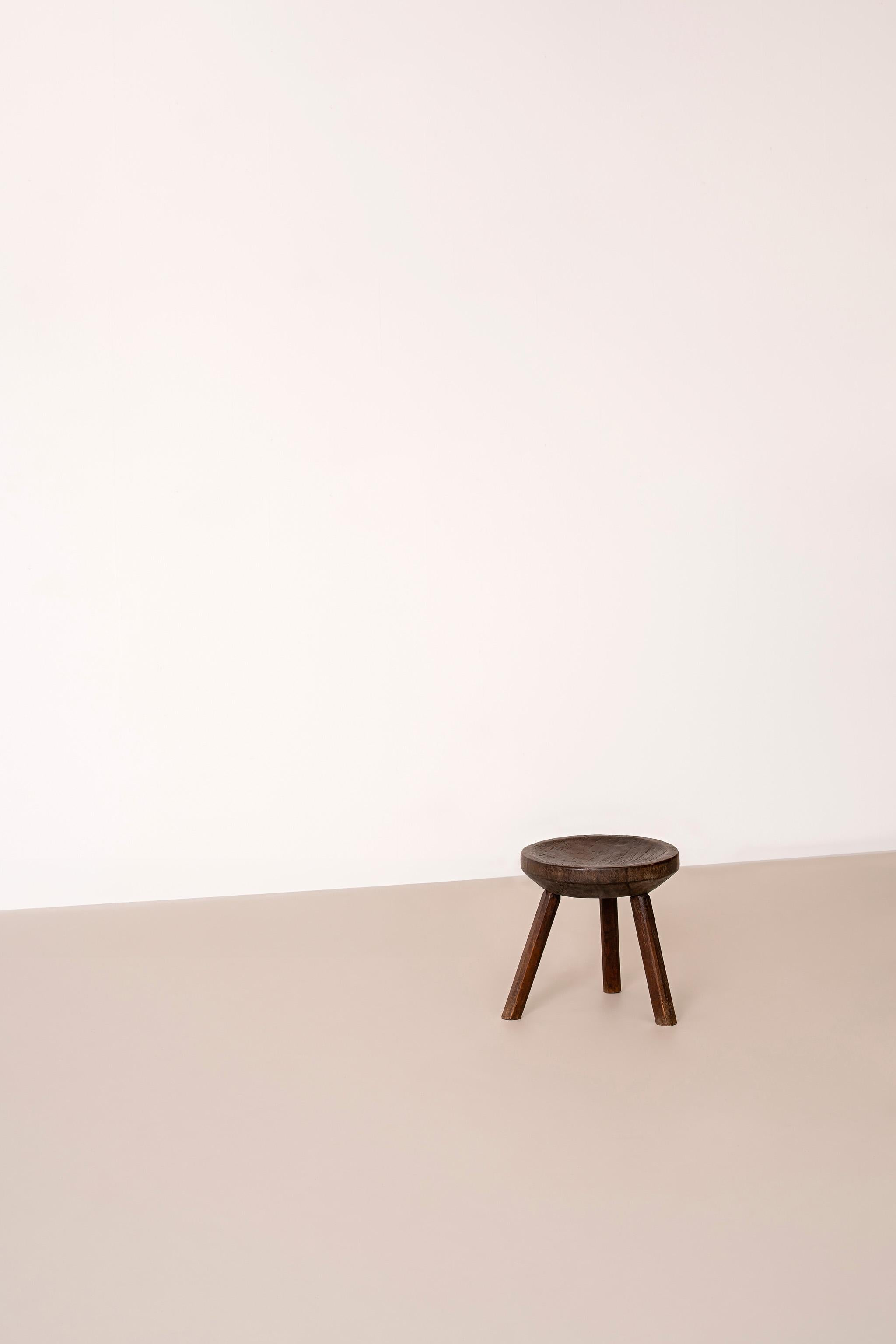 Brazilian vintage rustic three-legged stool in noble wood.