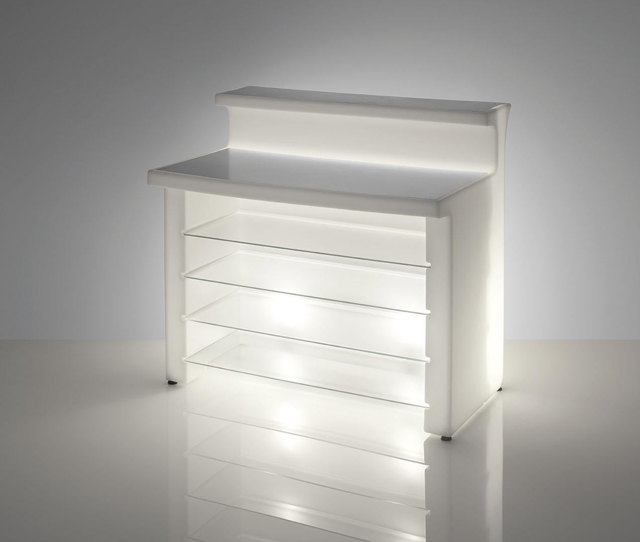Break Line Lighted Bar Counter by SLIDE Studio
Dimensions: D 75 x W 120 x H 110 cm.
Materials: Polyethylene, glass, and stainless steel.
Weight: 54,7 kg.

This product is suitable for indoor and outdoor use. Available in a lighted version.
