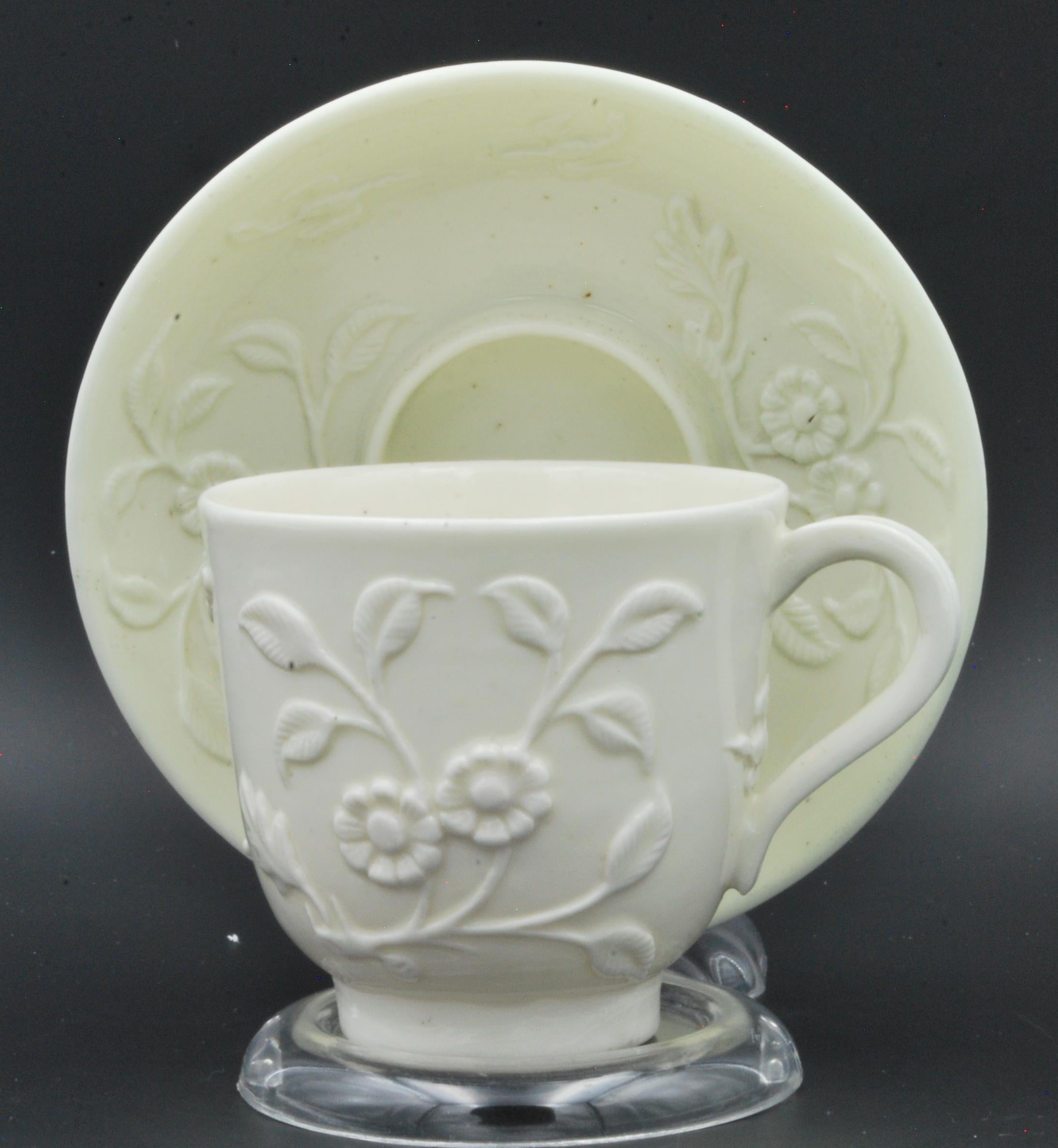 A most attractive and unusual pattern on this early example of French porcelain. While suggests a coffee cup to modern eyes, the decoration of tea plants in flower definitely says this was intended for tea.

Cup & saucer are both marked.