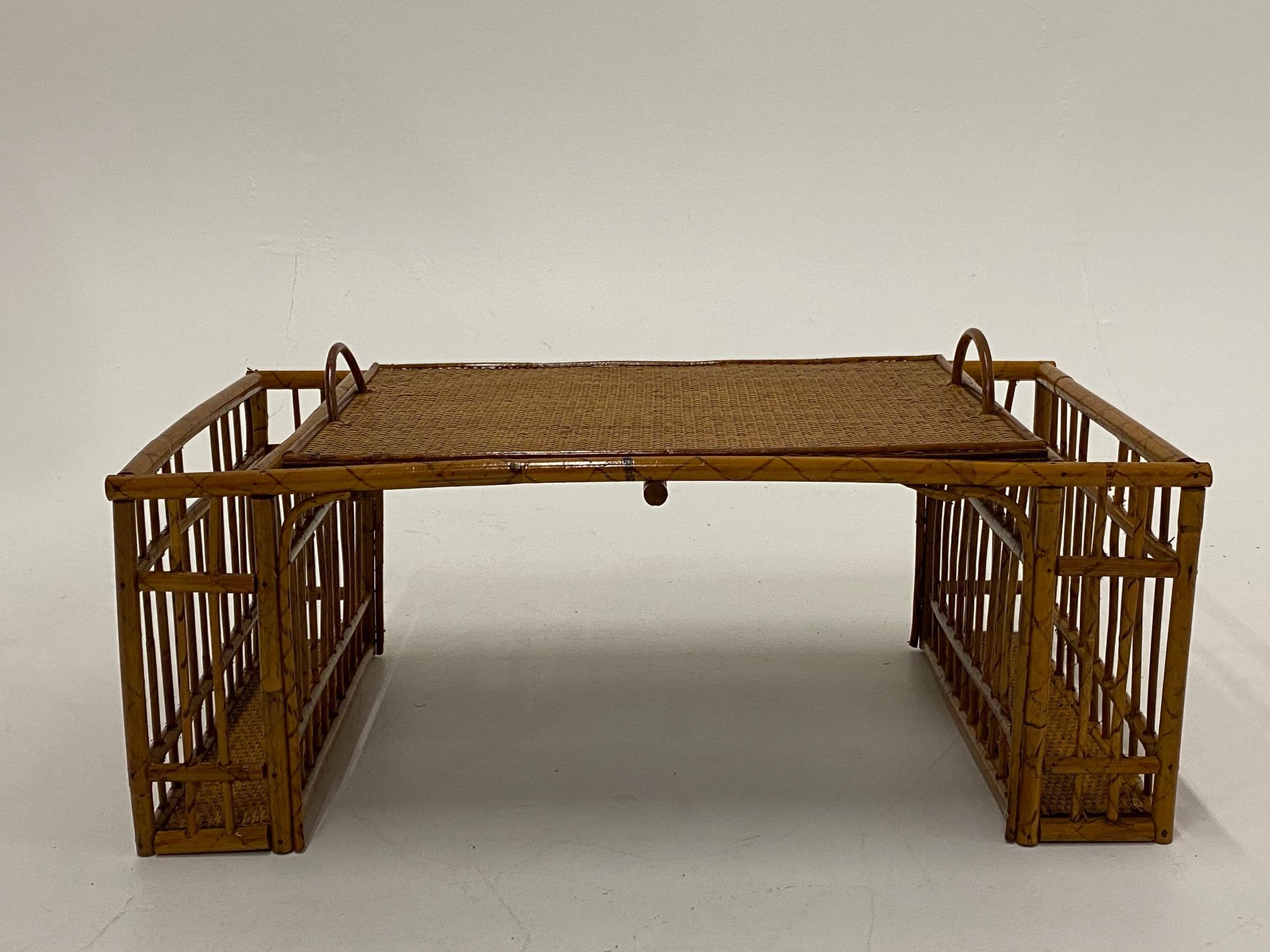 Functional and unusual vintage bamboo and rattan serving tray with adjustable top to allow reading in bed. Tray is also removeable.
Measure: 12.25 H with handles.