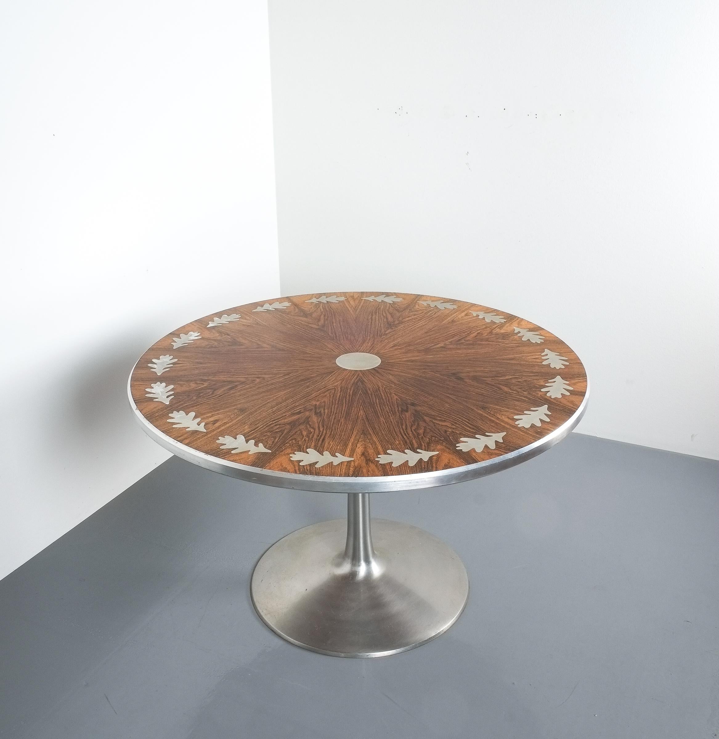 Breakfast or dining table by Steen Ostergaard for Poul Cadovius. Very elegant rosewood and aluminum table manufactured by France and Sons in the 1960s. It's in good condition featuring an aluminum table base and white rosewood aluminum oak-leaf