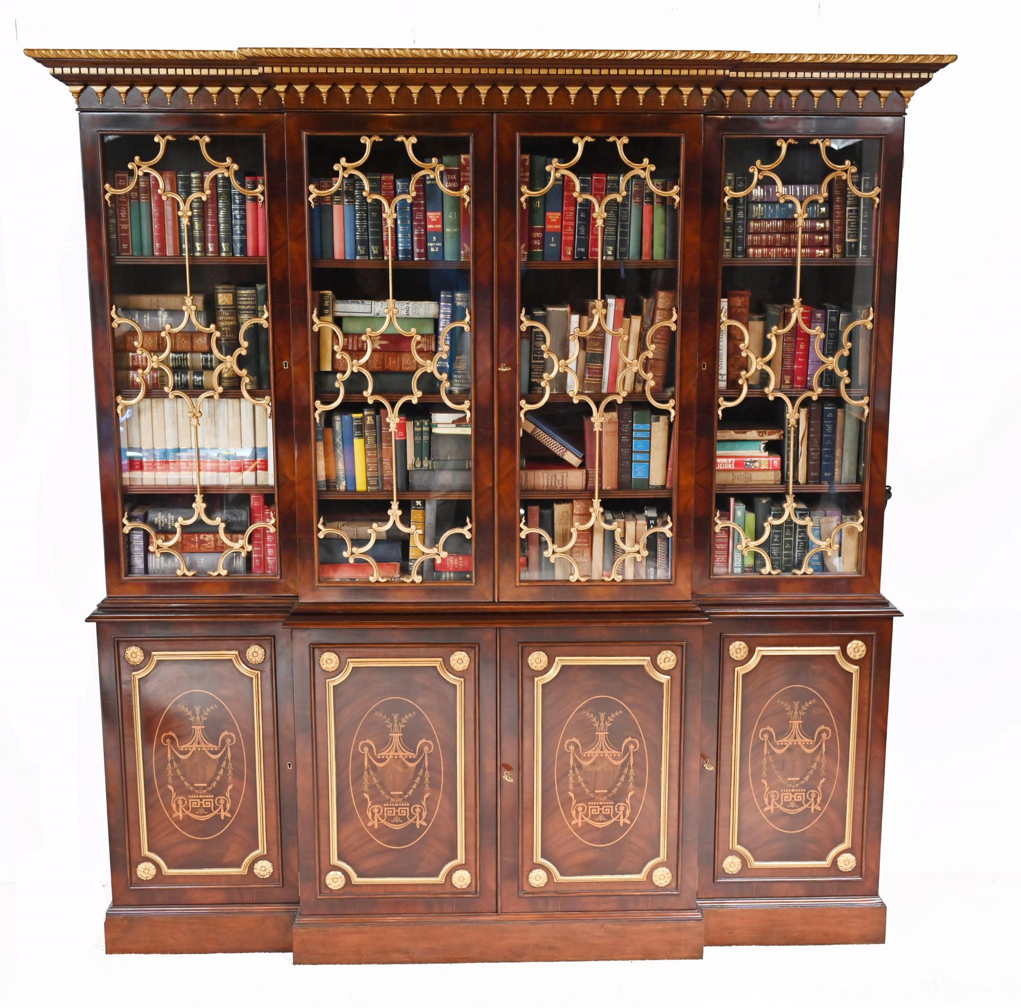 Wonderful breakfront bookcase in mahogany in the Chippendale style
Great look with the gilt sections of the astragal glazing - in the Gothic style - gilded
Top section comes apart from the bottom for ease of transport
Bottom sectin features
