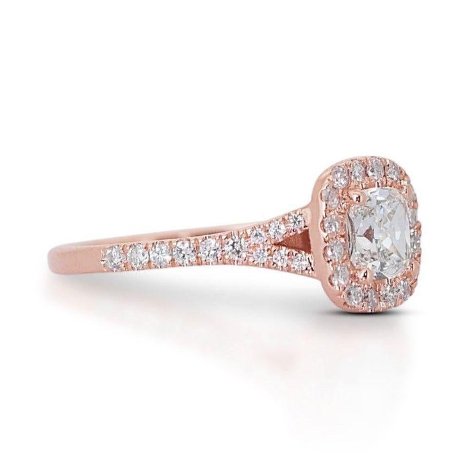 Embrace captivating elegance with this mesmerizing ring, showcasing a dazzling 0.9 carat cushion diamond nestled in luxurious 18K rose gold. The exceptional G color, boasting subtle warmth, and near-flawless VS2 clarity of the center diamond radiate