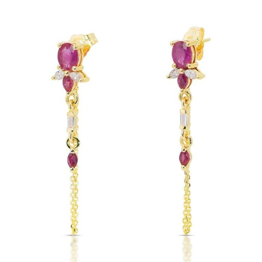 These breathtaking earrings are a symphony of elegance and sophistication, showcasing the timeless allure of rubies and diamonds.

Adorning the earrings are six stunning rubies, weighing 1.20 carats. These rubies are meticulously cut into marquise