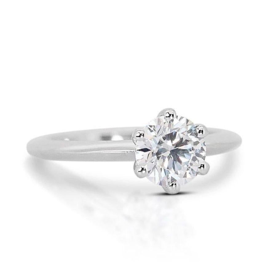 Own a Piece of Forever: Invest in eternity with this breathtaking 1-carat round brilliant diamond ring. F color's pure brilliance transcends trends, whispering a promise of beauty that endures. VVS1 clarity ensures a heart as flawless as your